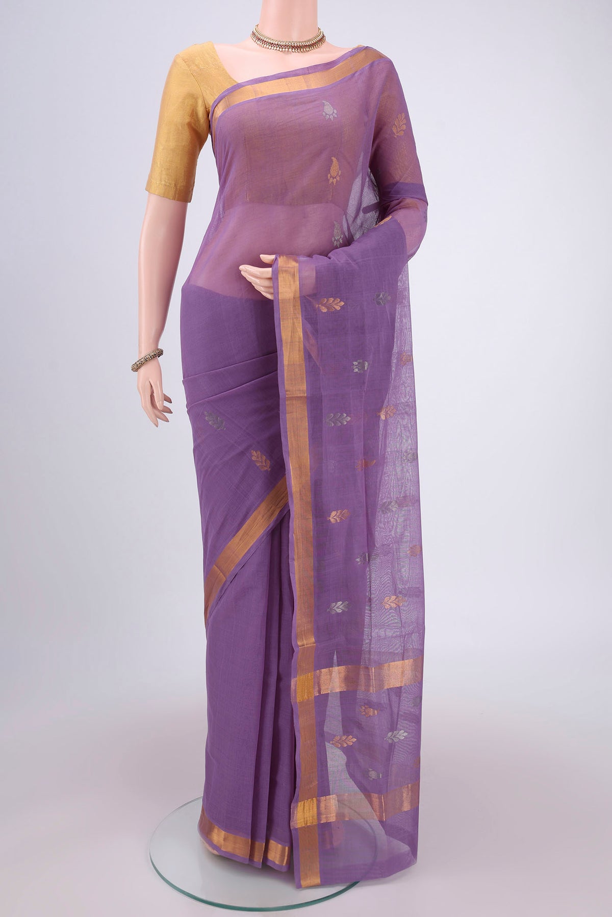 Mauve Venkatagiri Cotton Saree with Zari Butta on the body and Zari Border.  displayed on a mannequin