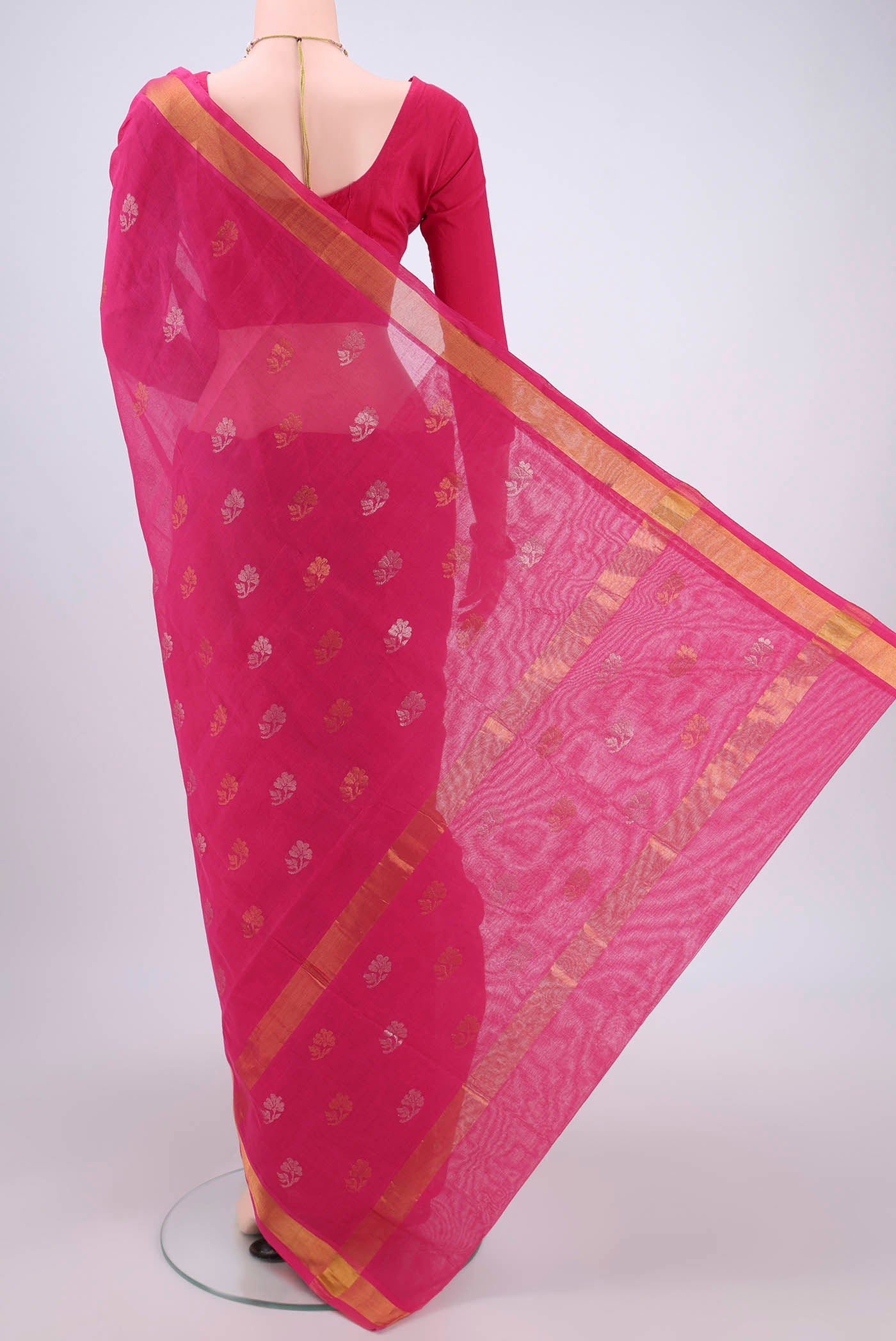 Flat view of Rani Pink Venkatagiri Cotton Saree with Zari Butta on the body and Zari Border. 