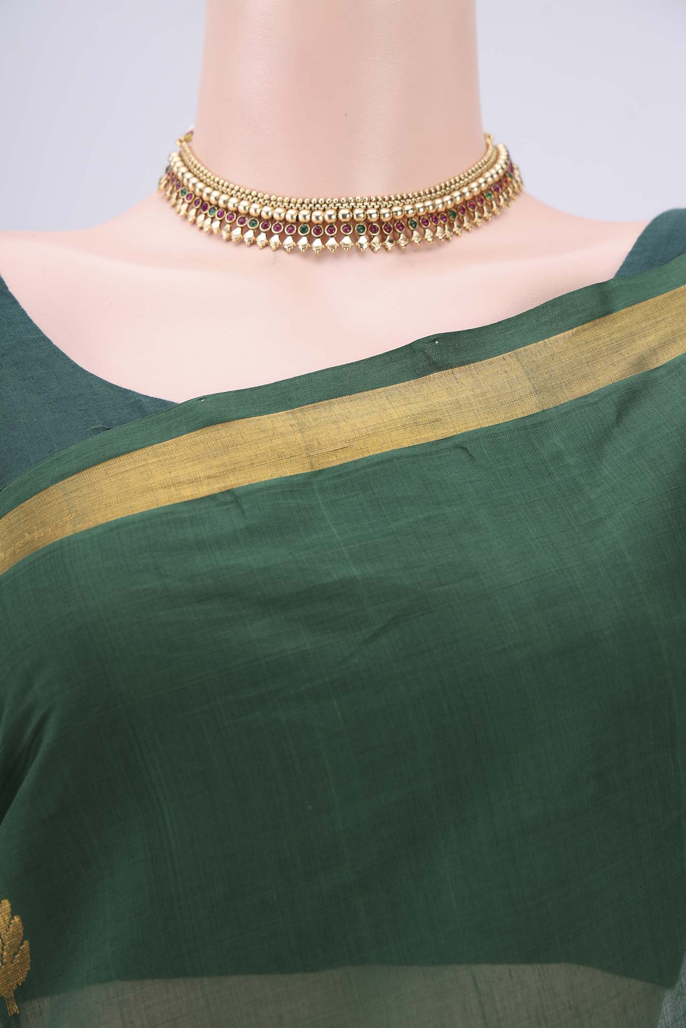 Border image of Green Cotton Saree with Zari Butta on the body and Zari Border. 