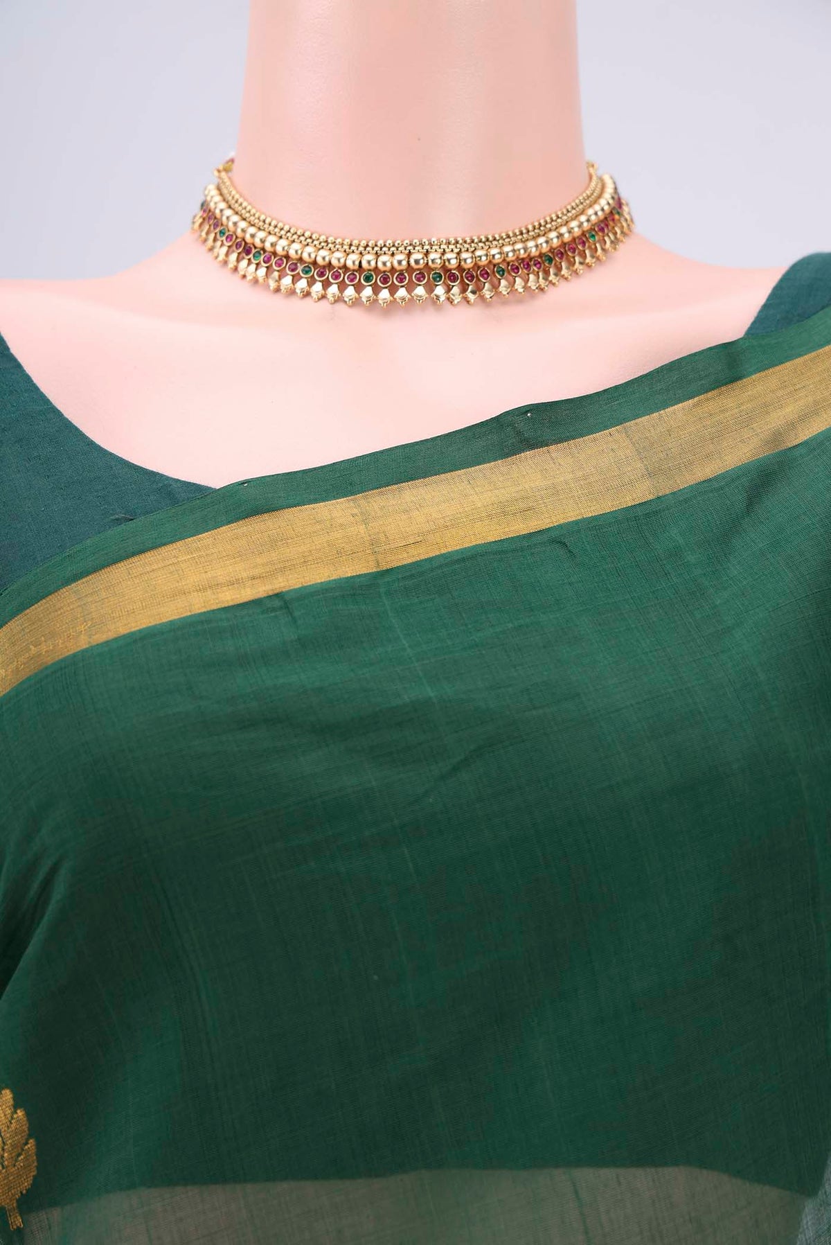 Border image of Green Cotton Saree with Zari Butta on the body and Zari Border. 