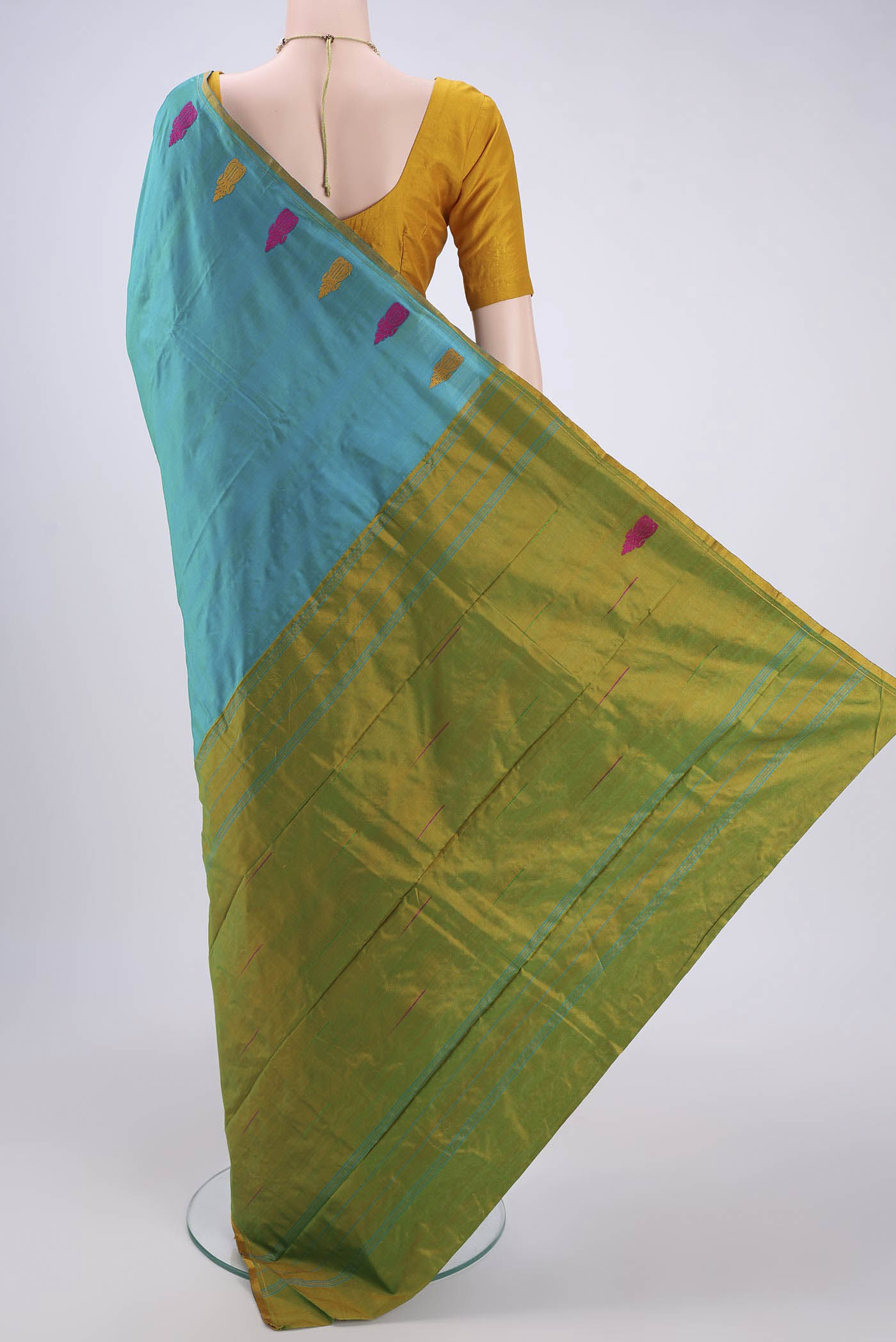 Flat view of Sea Green Dual Tone Kanchipuram Silk Saree with Plain Body and Thread Border. 