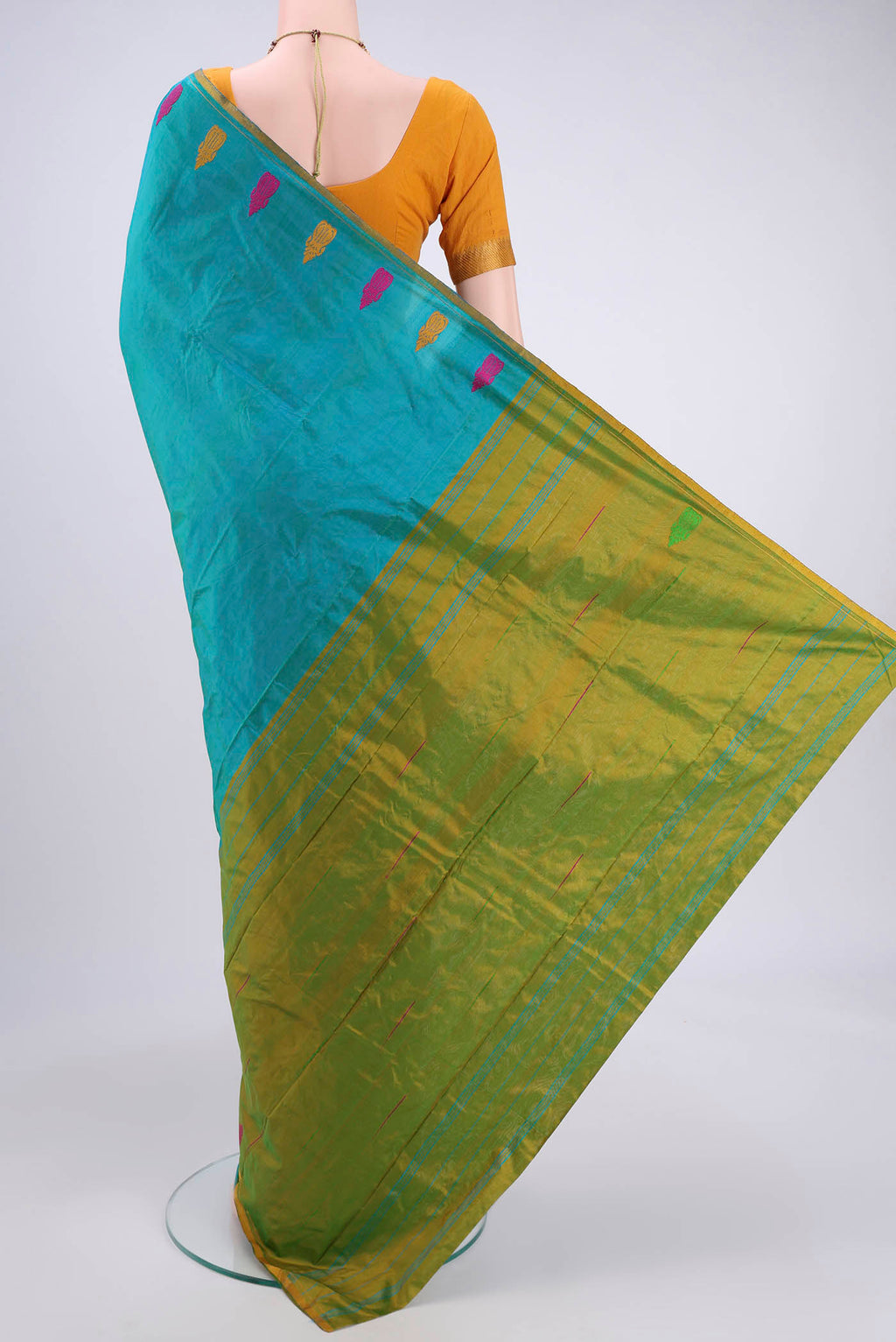 Flat view of Sea Green Dual Tone Kanchipuram Silk Saree with Plain Body and Zari And Thread Border. 