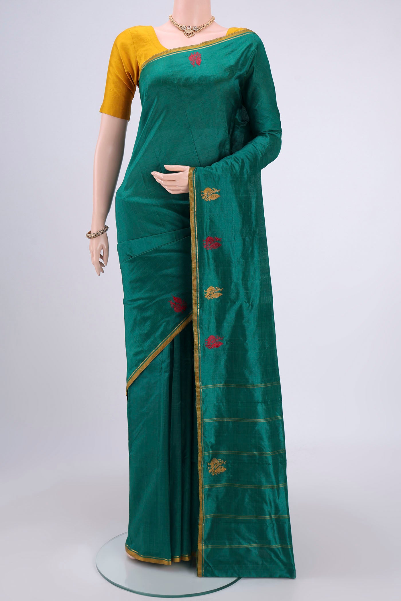 Green Dual Tone Kanchipuram Silk Saree with Plain Body and Zari And Thread Border.  displayed on a mannequin