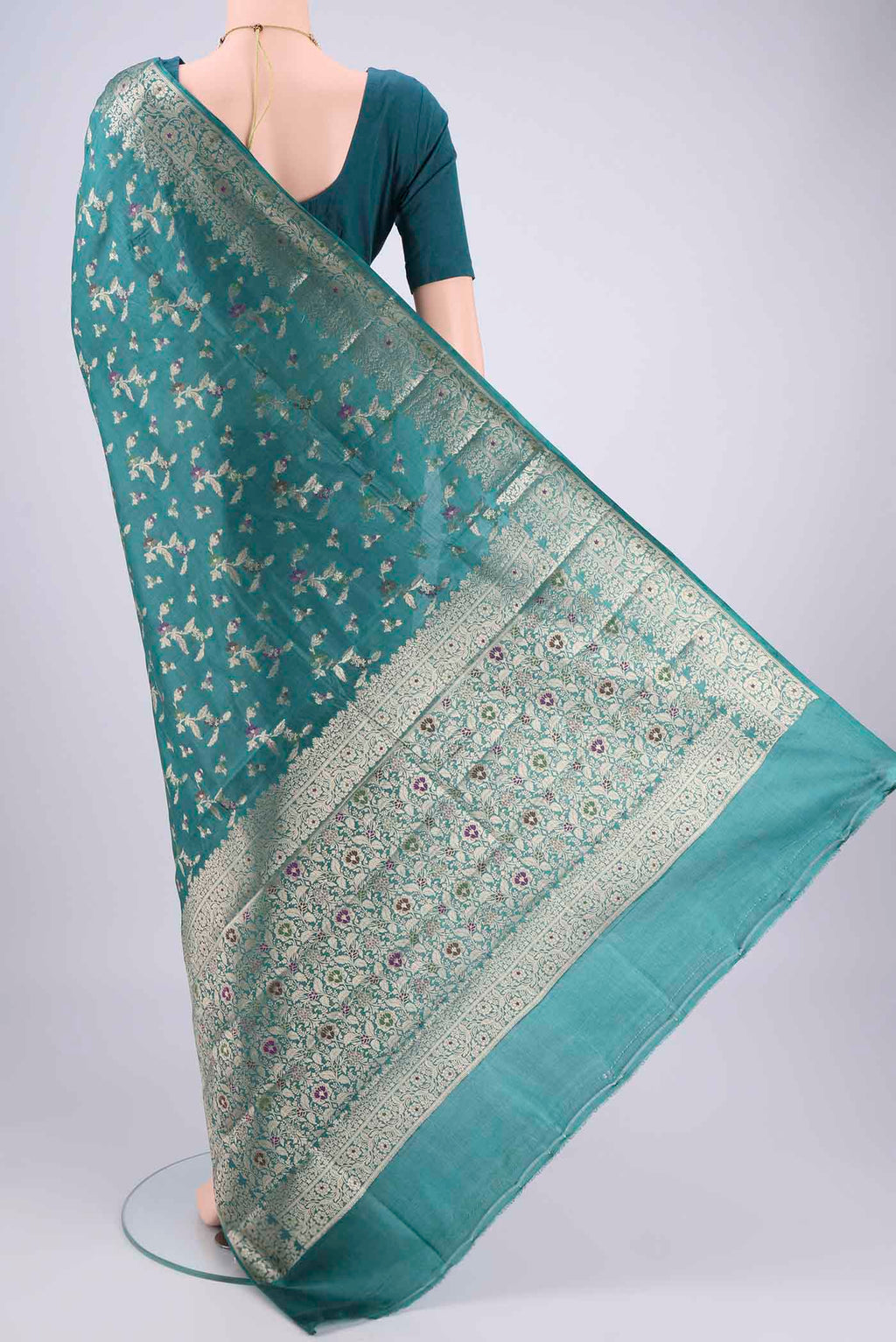 Flat view of Sea Green Banarasi Tussar Silk Saree with Zari And Thread Butta on the body and Zari And Thread Border. 