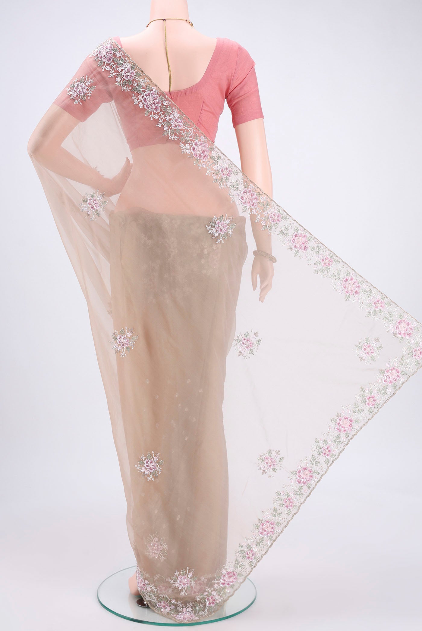 Flat view of Beige Organza Silk Saree with Embroidery on the body and Embroidery Border. 