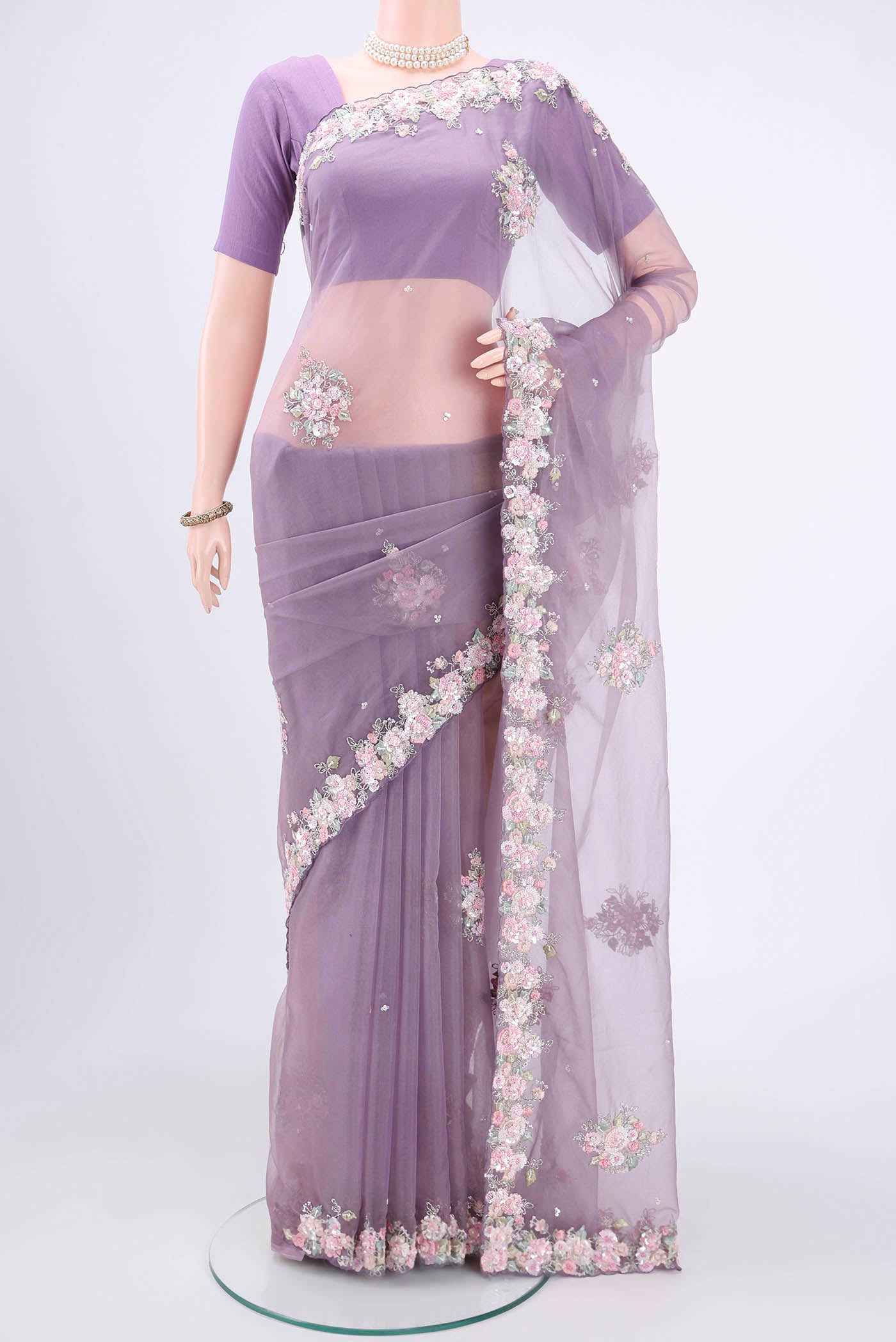 Dark Mauve Organza Silk Saree with Embroidery on the body and Embroidery Border.  displayed on a mannequin
