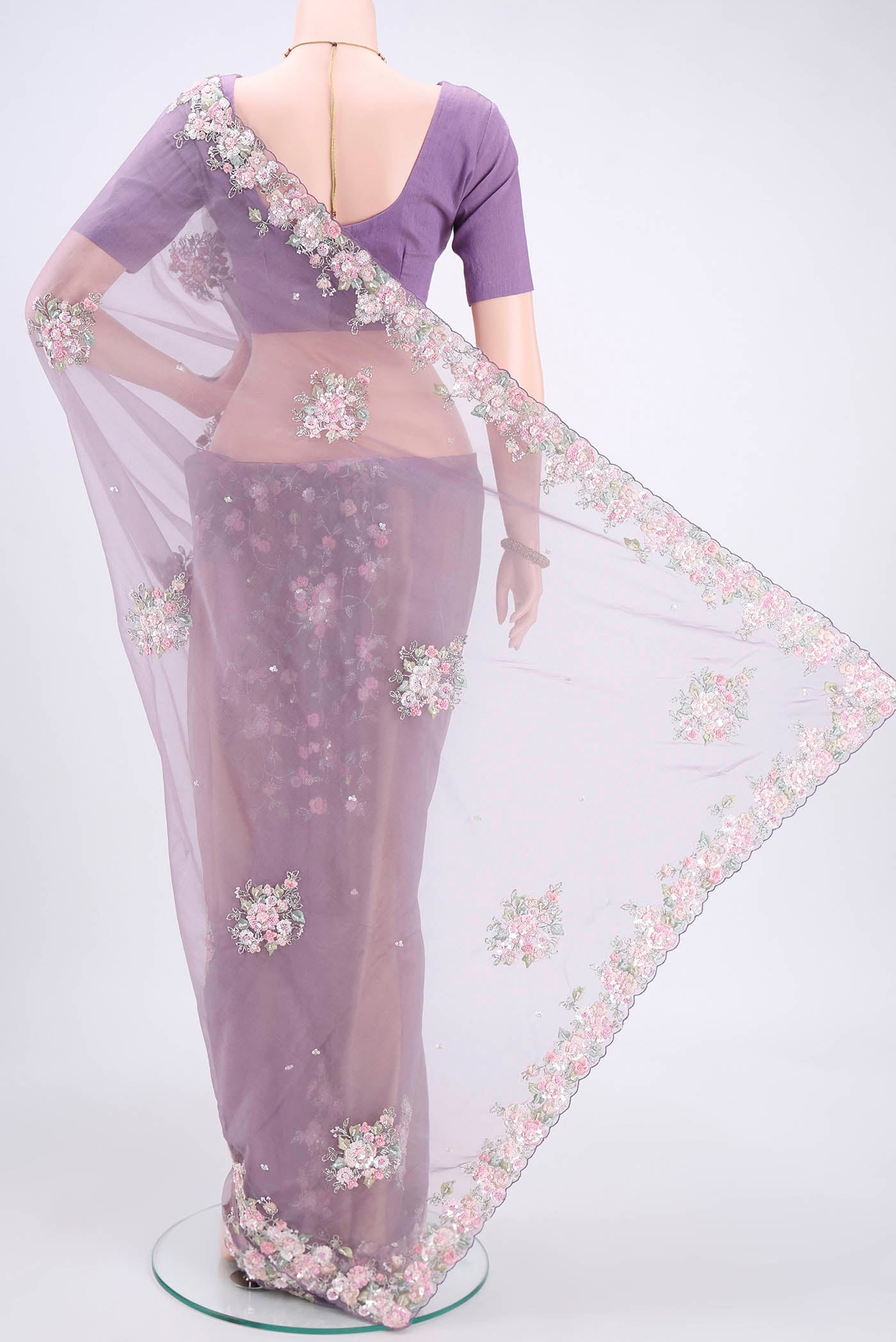 Flat view of Dark Mauve Organza Silk Saree with Embroidery on the body and Embroidery Border. 