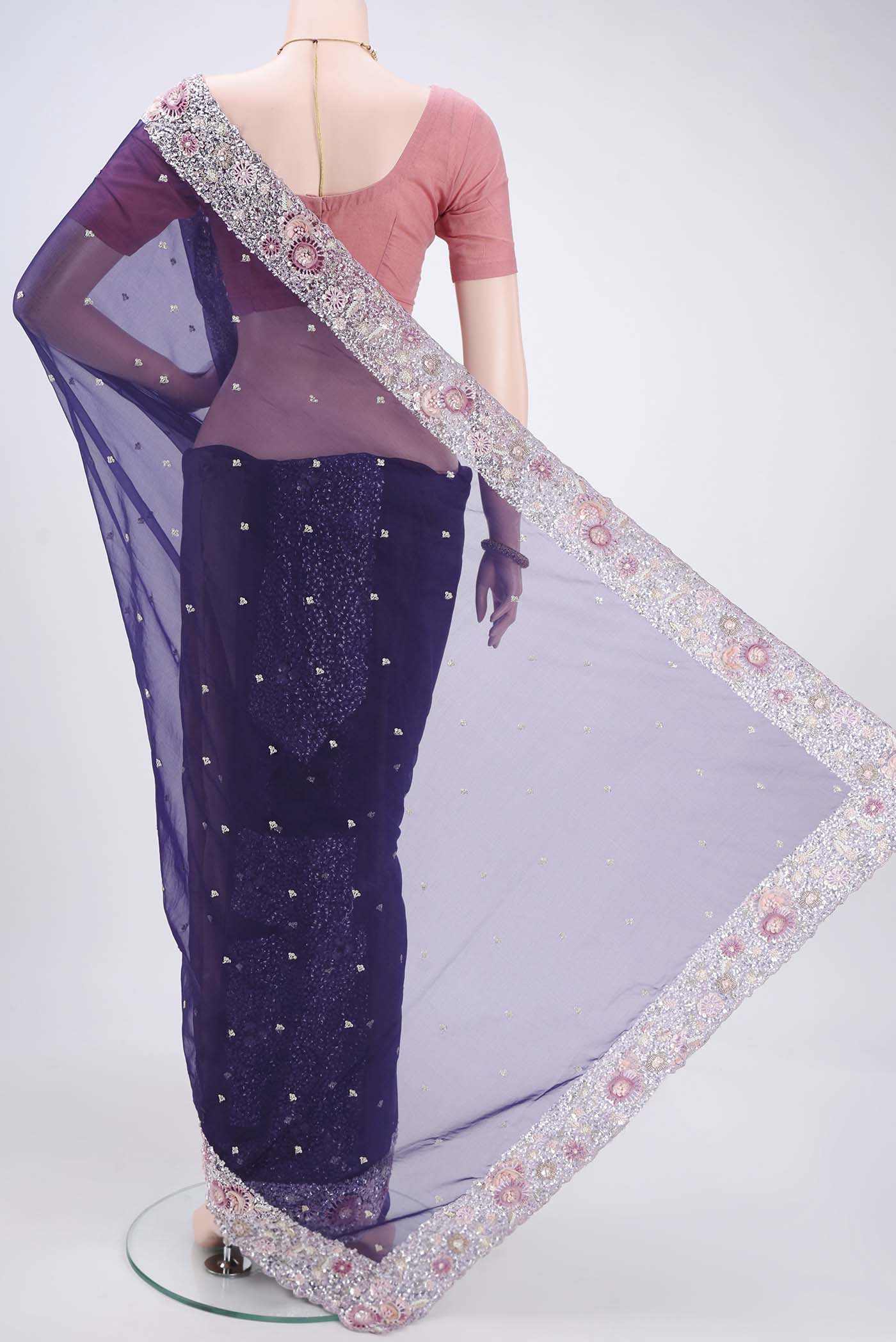 Flat view of Purple Organza Silk Saree with Embroidery on the body and Embroidery Border. 