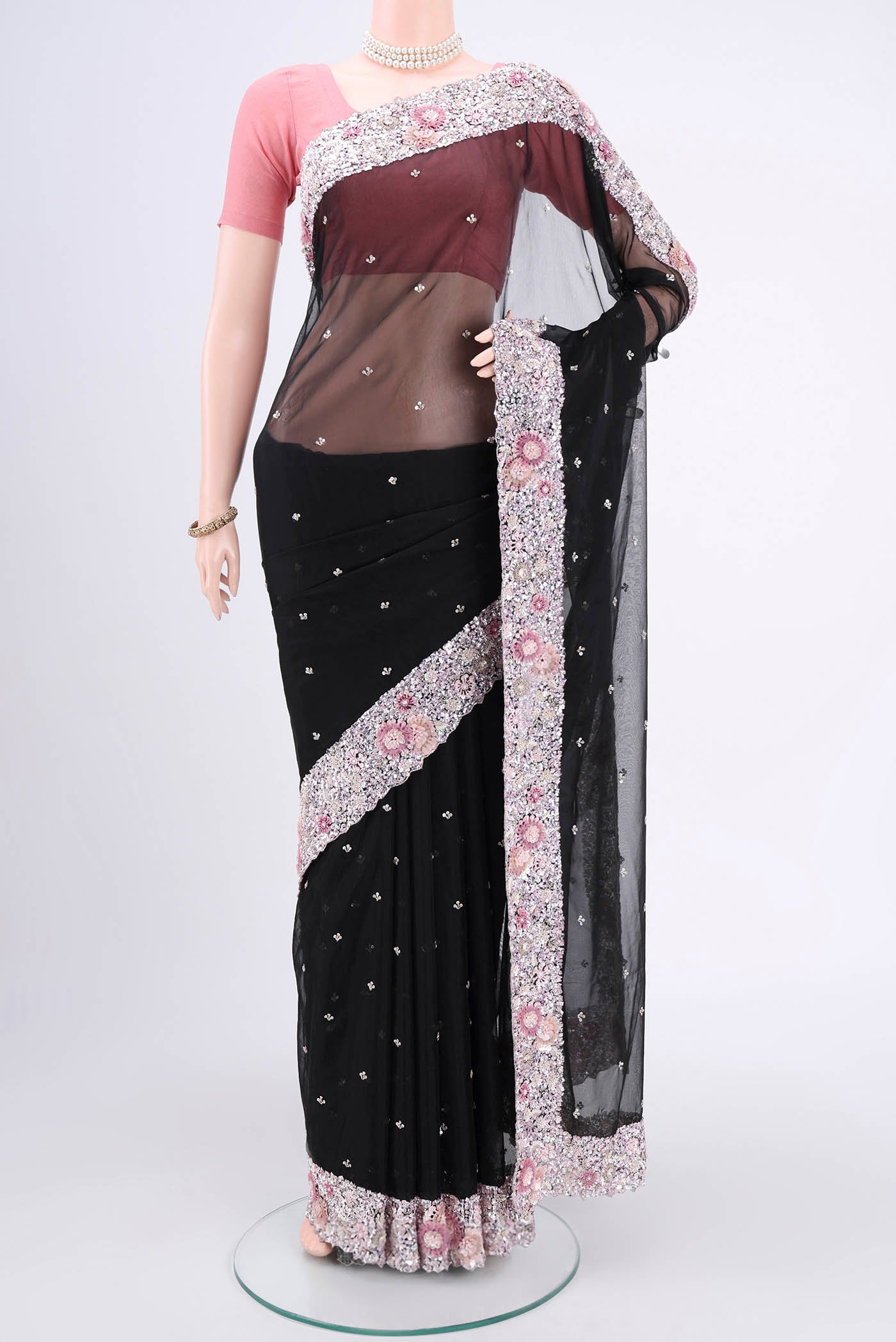 Black Organza Silk Saree with Embroidery on the body and Embroidery Border.  displayed on a mannequin