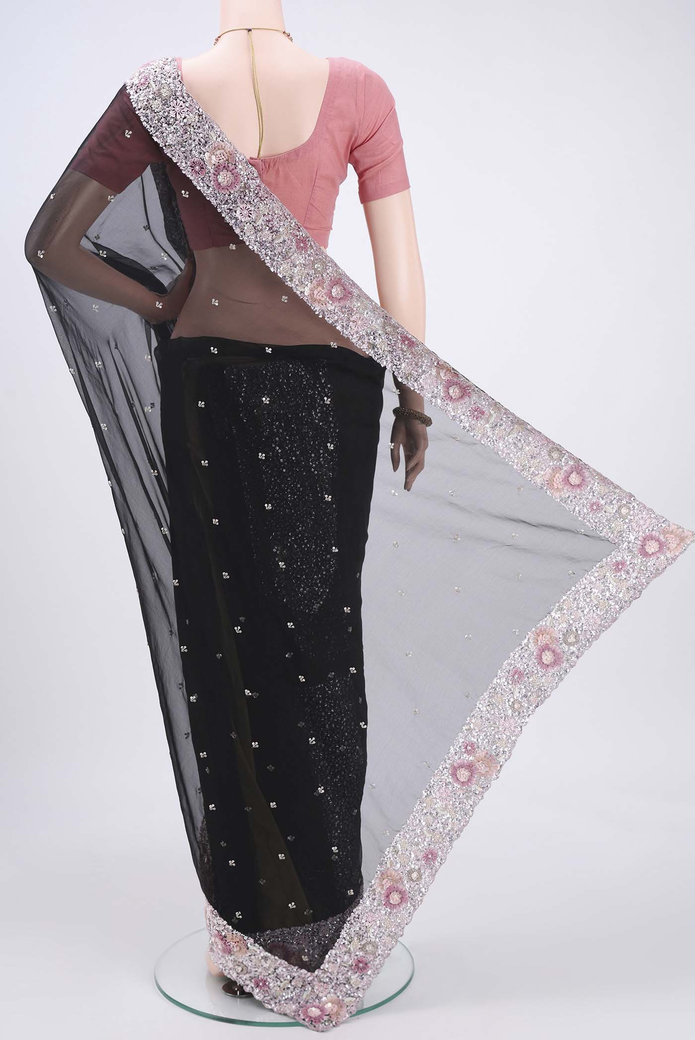 Flat view of Black Organza Silk Saree with Embroidery on the body and Embroidery Border. 