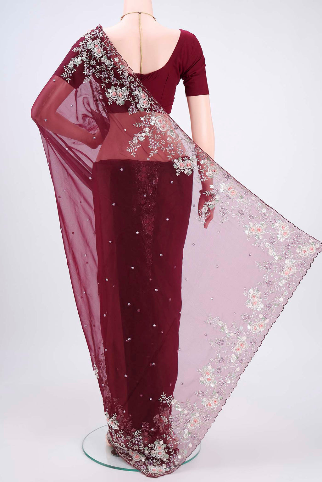 Flat view of Maroon Organza Silk Saree with Embroidery on the body and Embroidery Border. 