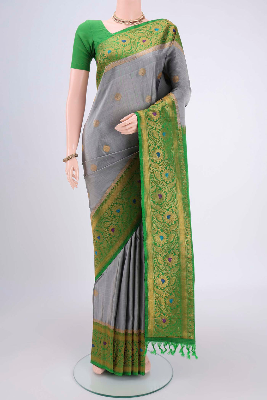 Grey Gadwal Silk Saree with Zari Brocade on the body and Zari Border.  displayed on a mannequin