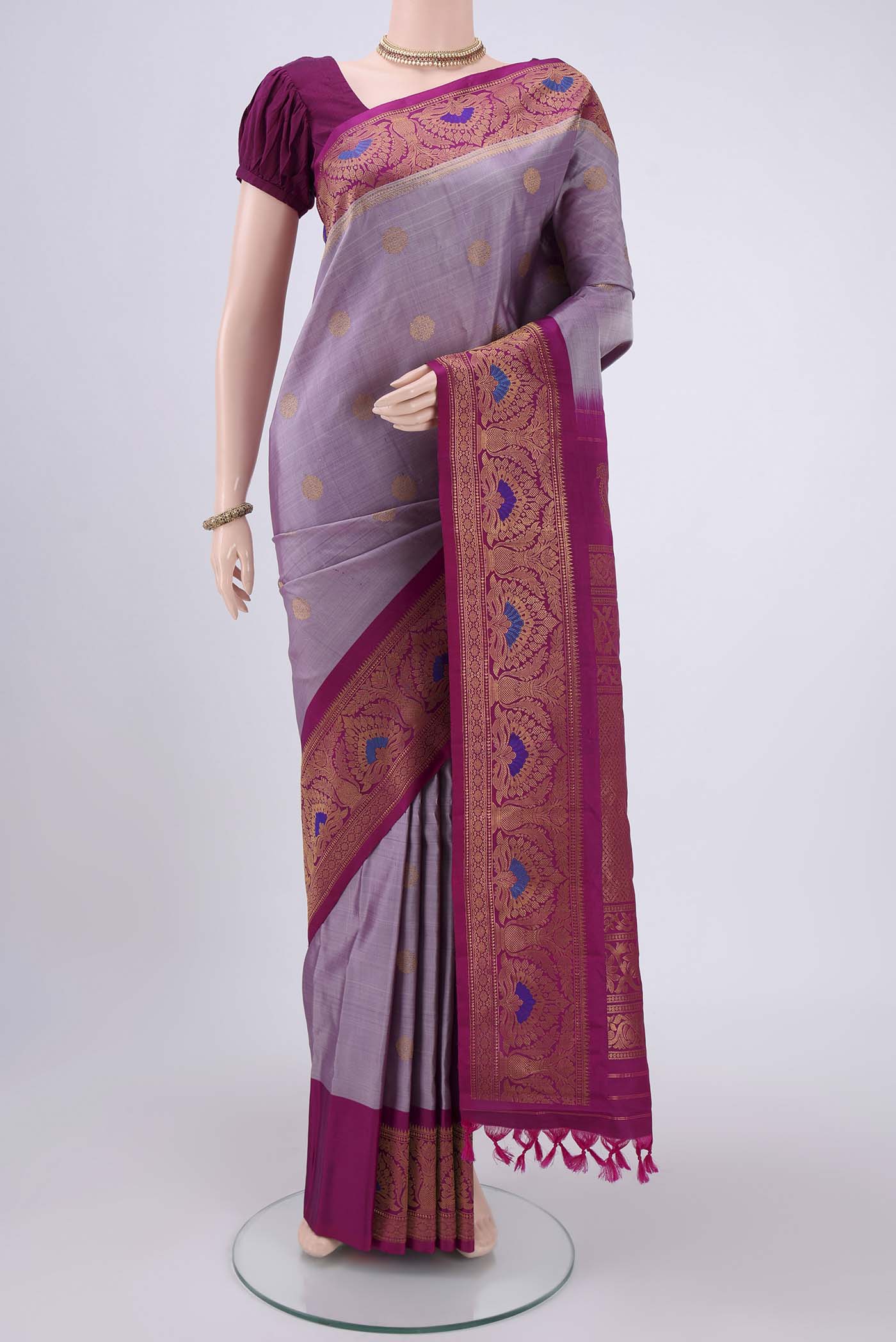Mauve Gadwal Silk Saree with Zari Brocade on the body and Zari Border.  displayed on a mannequin