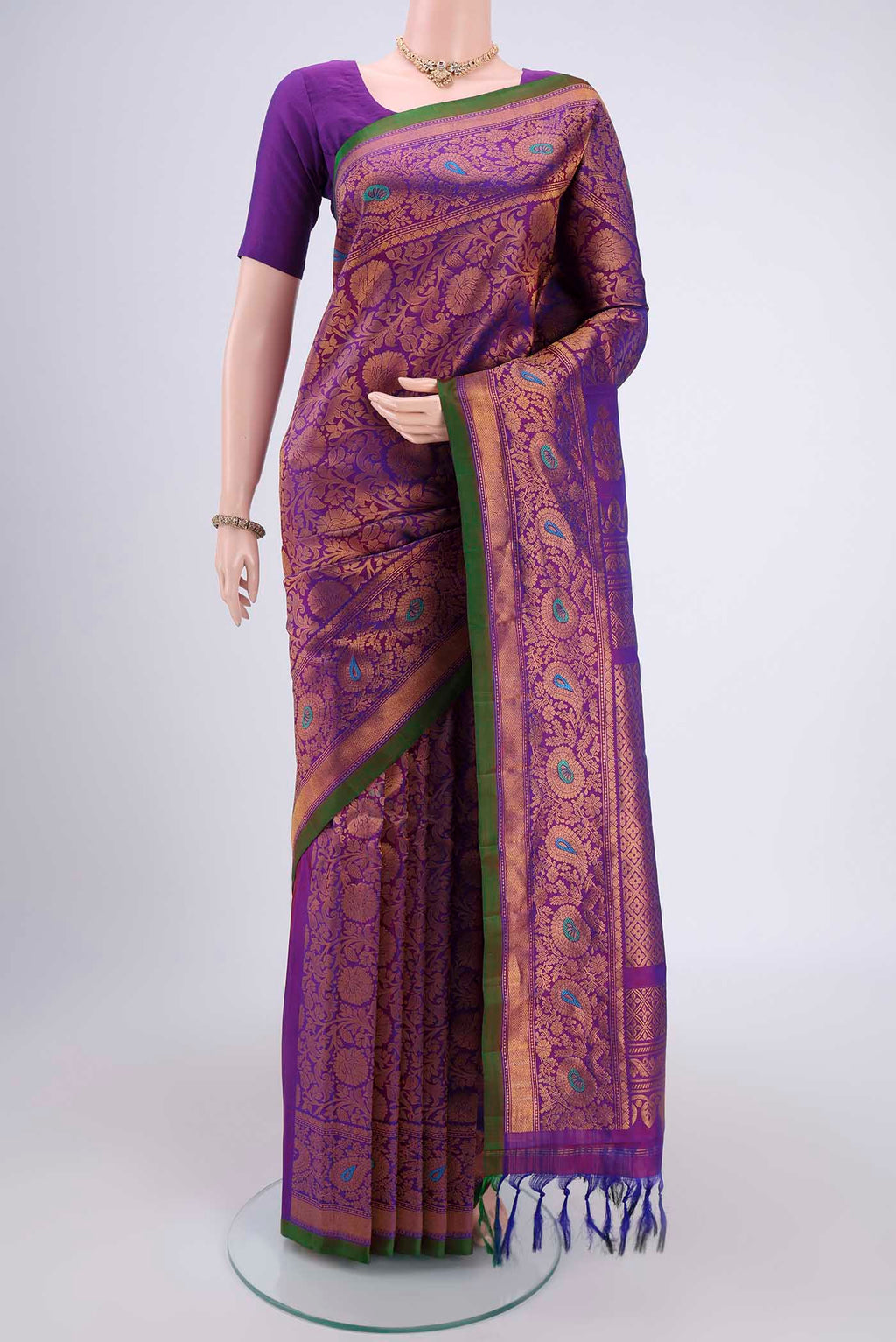 Purple Gadwal Silk Saree with Zari Butta on the body and Zari Border.  displayed on a mannequin