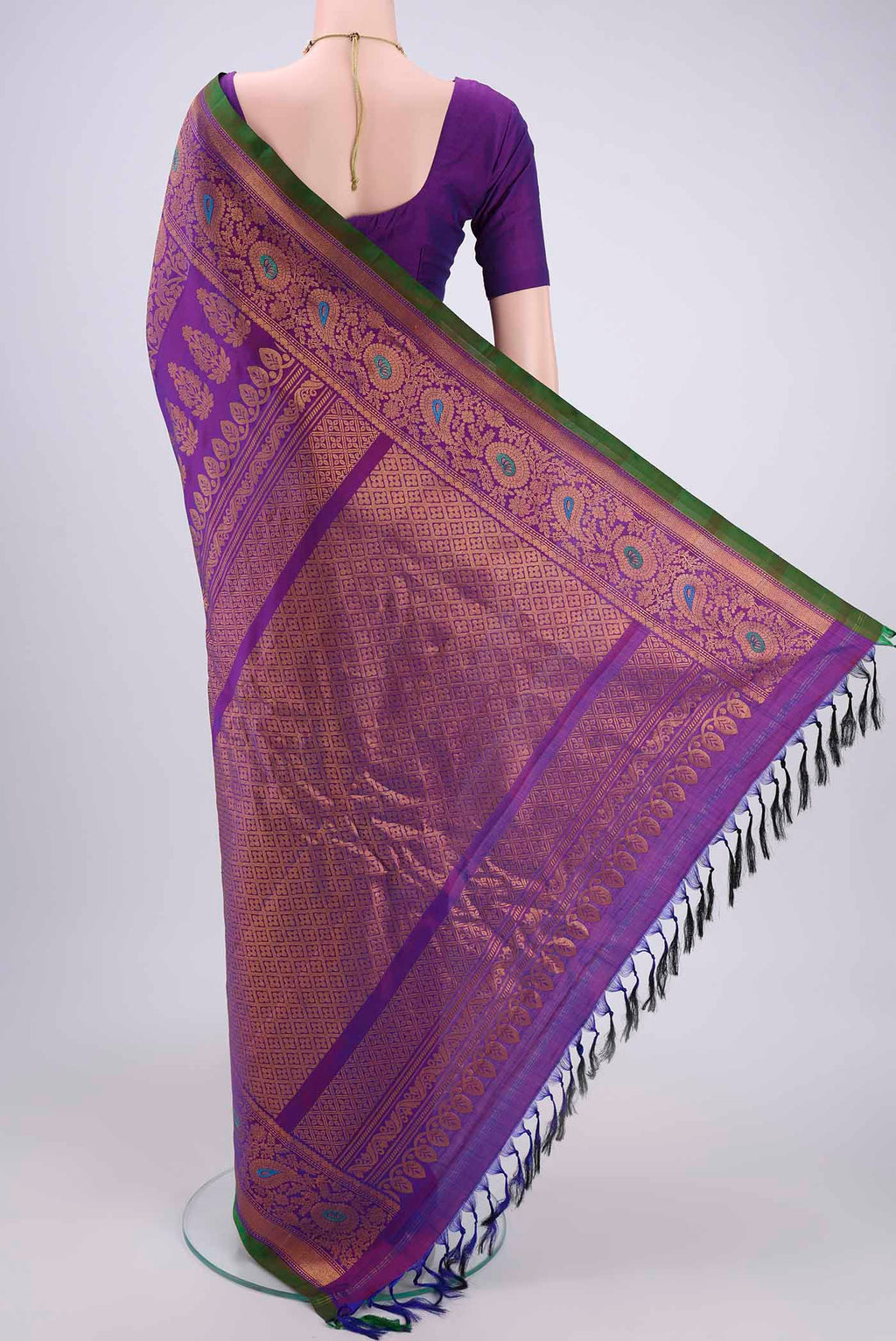 Flat view of Purple Gadwal Silk Saree with Zari Butta on the body and Zari Border. 