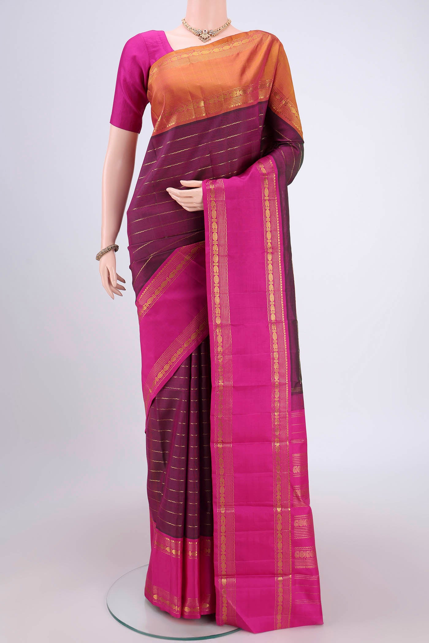 Magenta Dual Tone Kanjivaram Silk Saree with Veldhari on the body and Ganga Jamuna Border.  displayed on a mannequin
