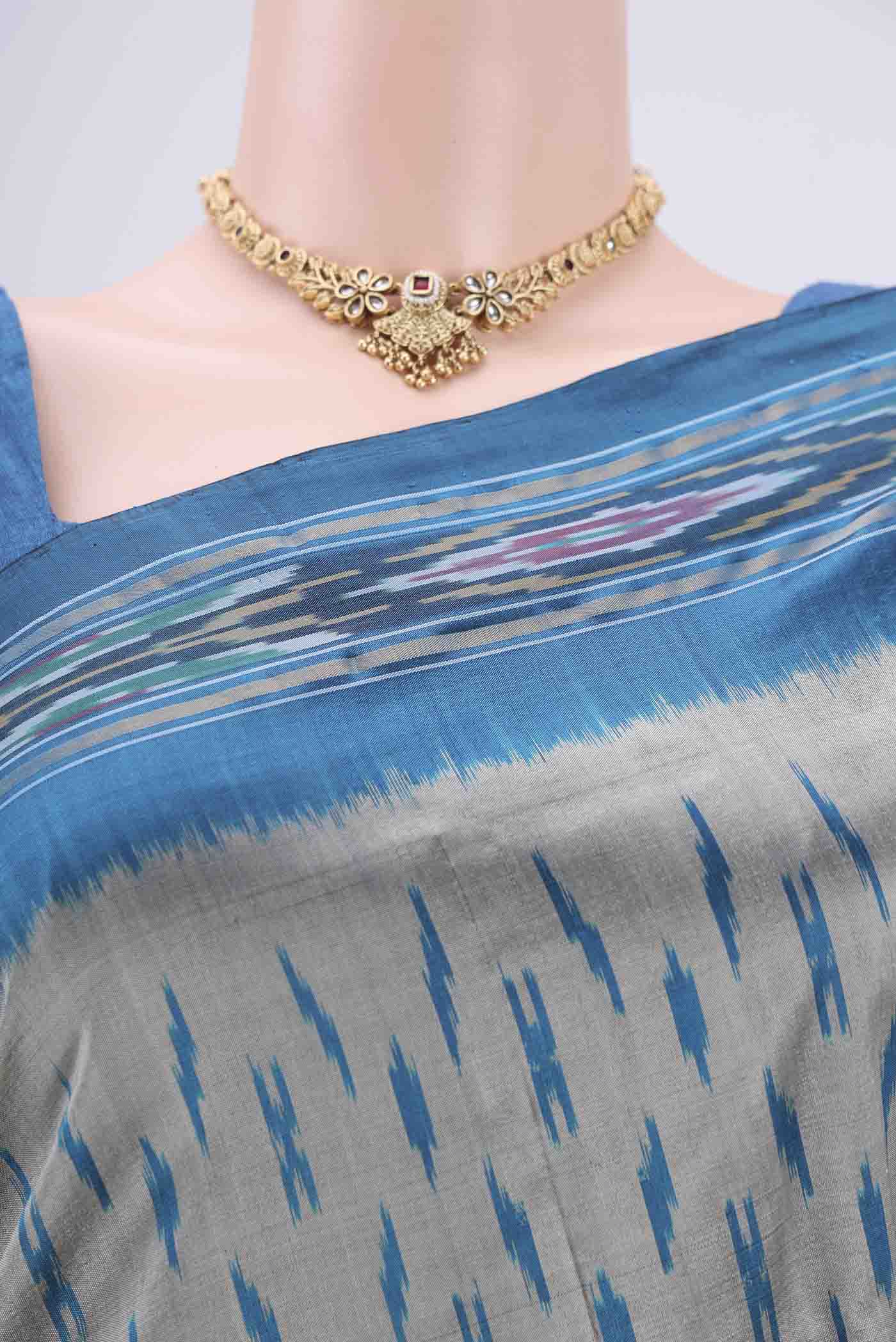 Border image of Silver Pochampally Silk Saree with Ikat design on the body and Ikat Border. 