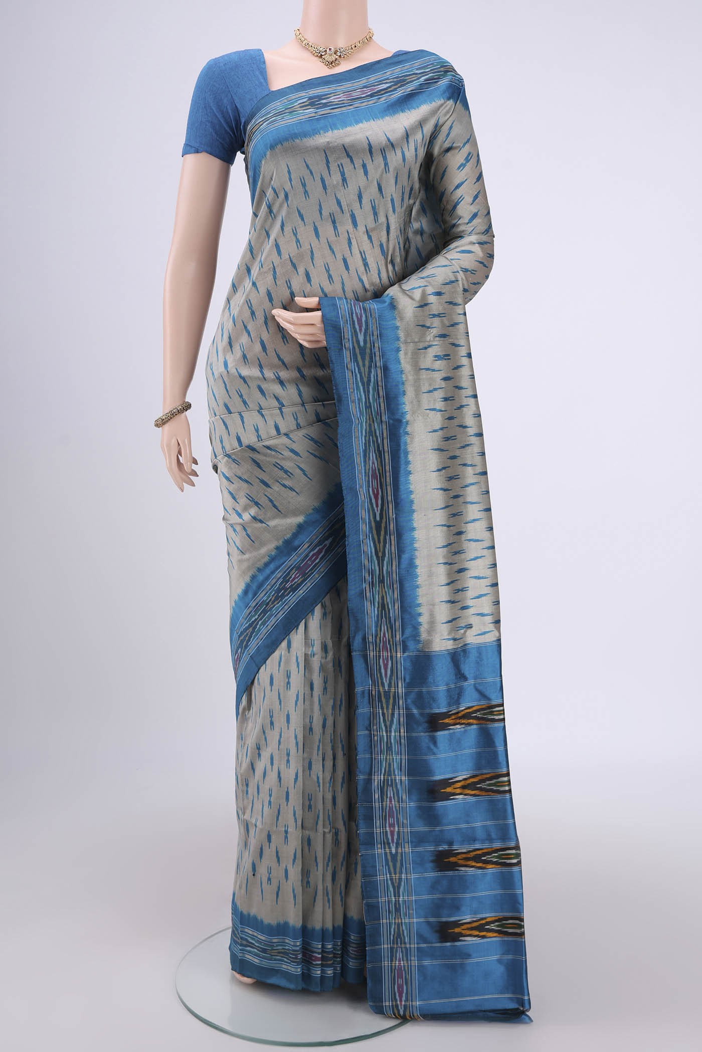 Silver Pochampally Silk Saree with Ikat design on the body and Ikat Border.  displayed on a mannequin