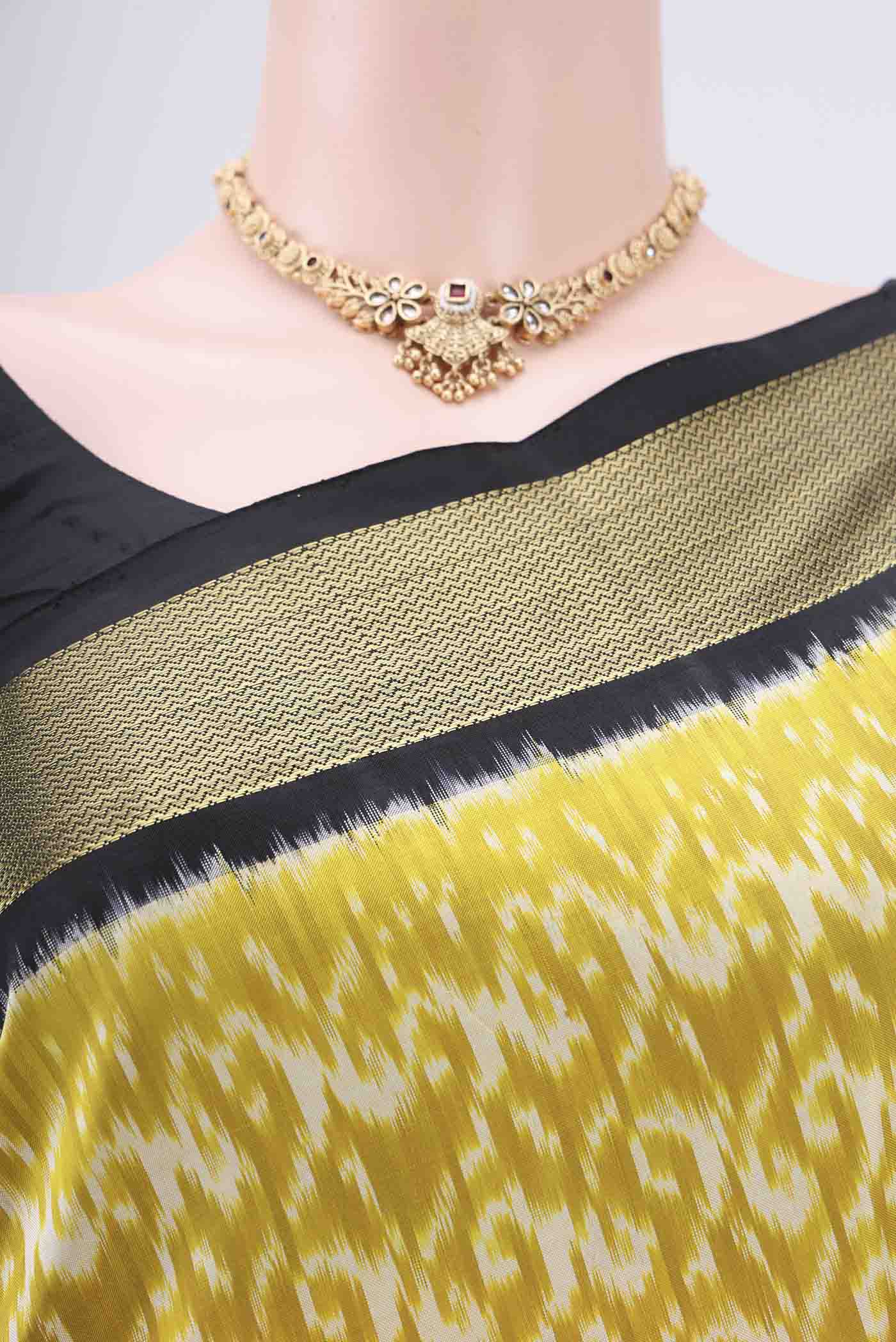 Border image of Acid Green Pochampally Silk Saree with Ikat Print on the body and Zari Border. 