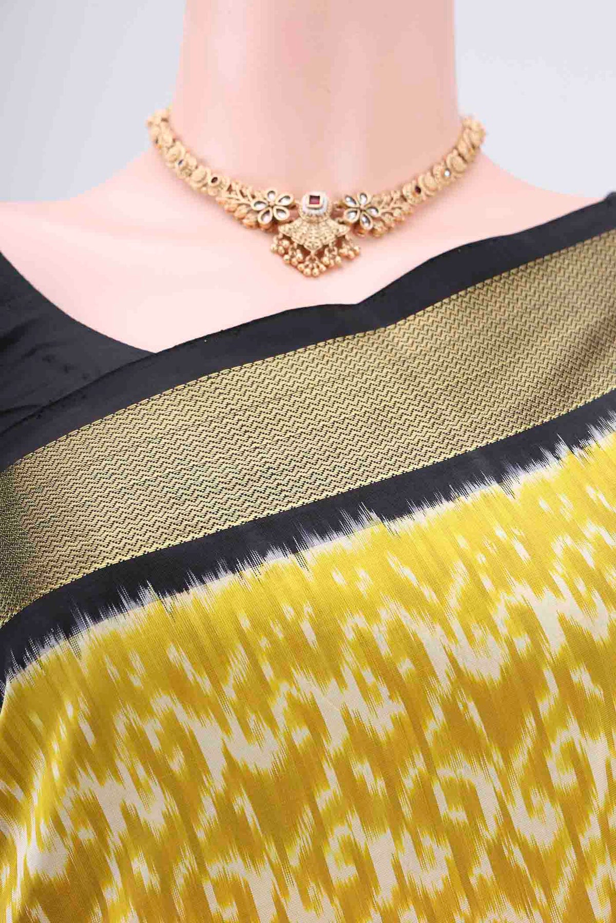 Border image of Acid Green Pochampally Silk Saree with Ikat Print on the body and Zari Border. 