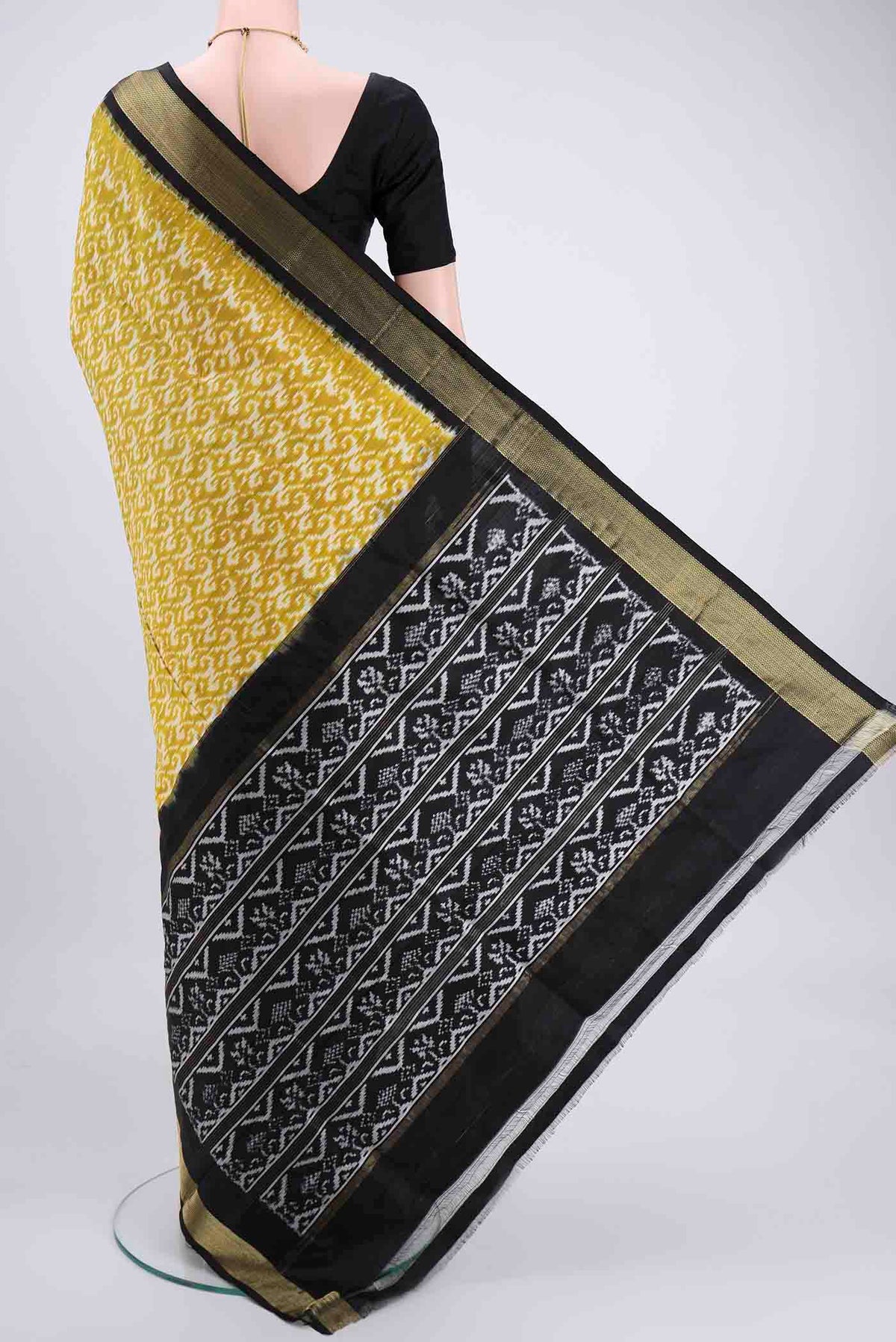 Flat view of Acid Green Pochampally Silk Saree with Ikat Print on the body and Zari Border. 