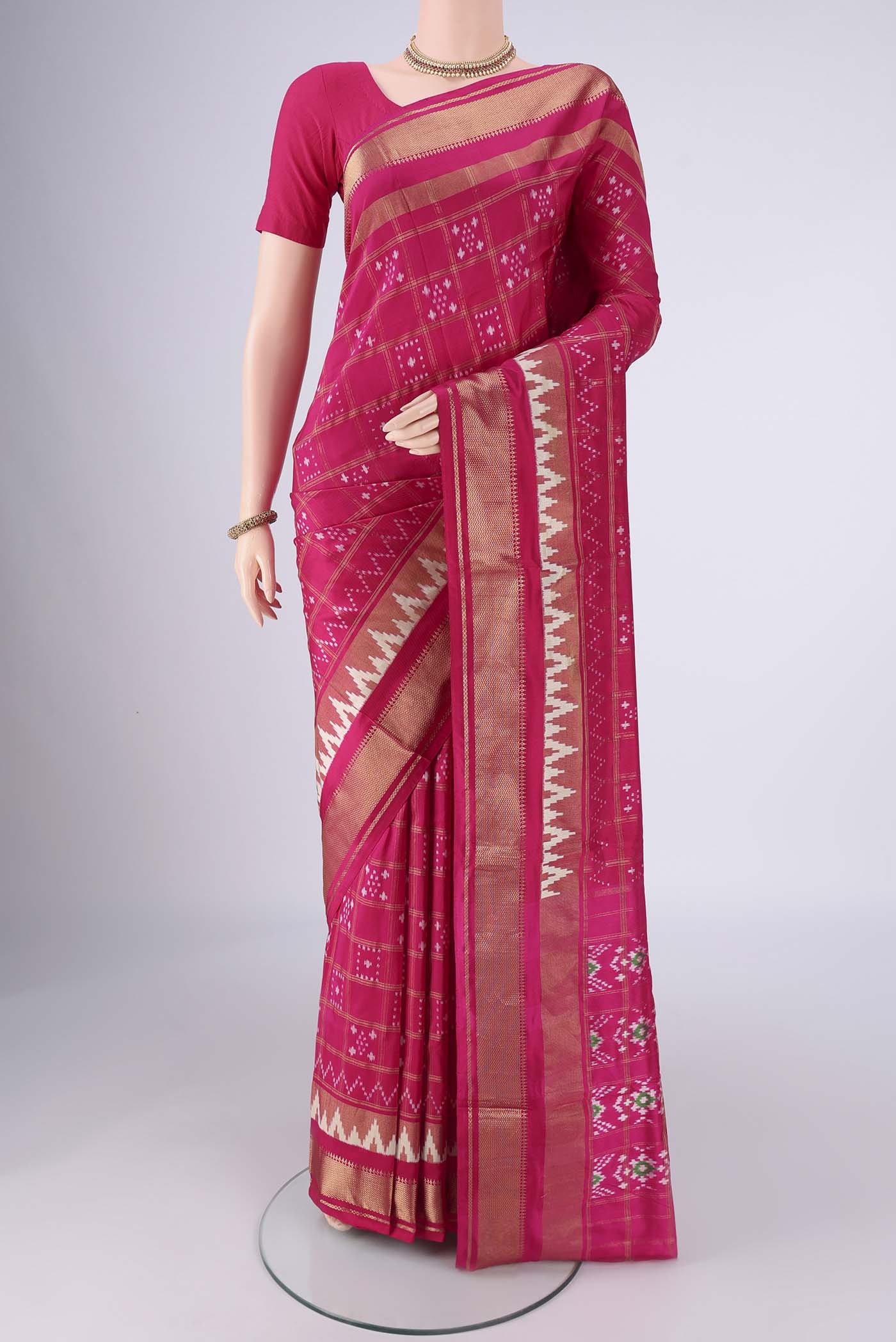 Pink Pochampally Silk Saree with Pure Ikat on the body and Zari Border.  displayed on a mannequin