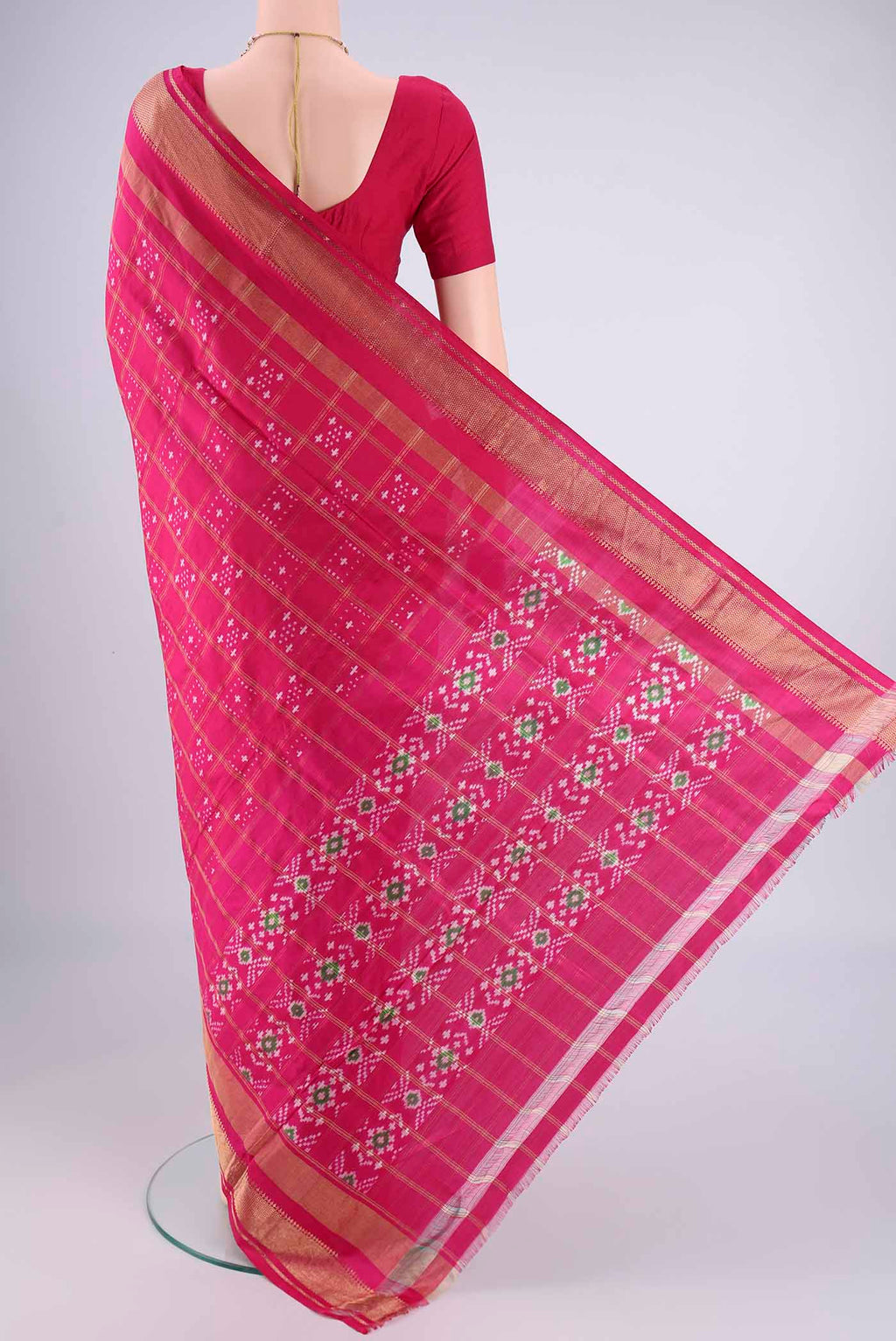 Flat view of Pink Pochampally Silk Saree with Pure Ikat on the body and Zari Border. 