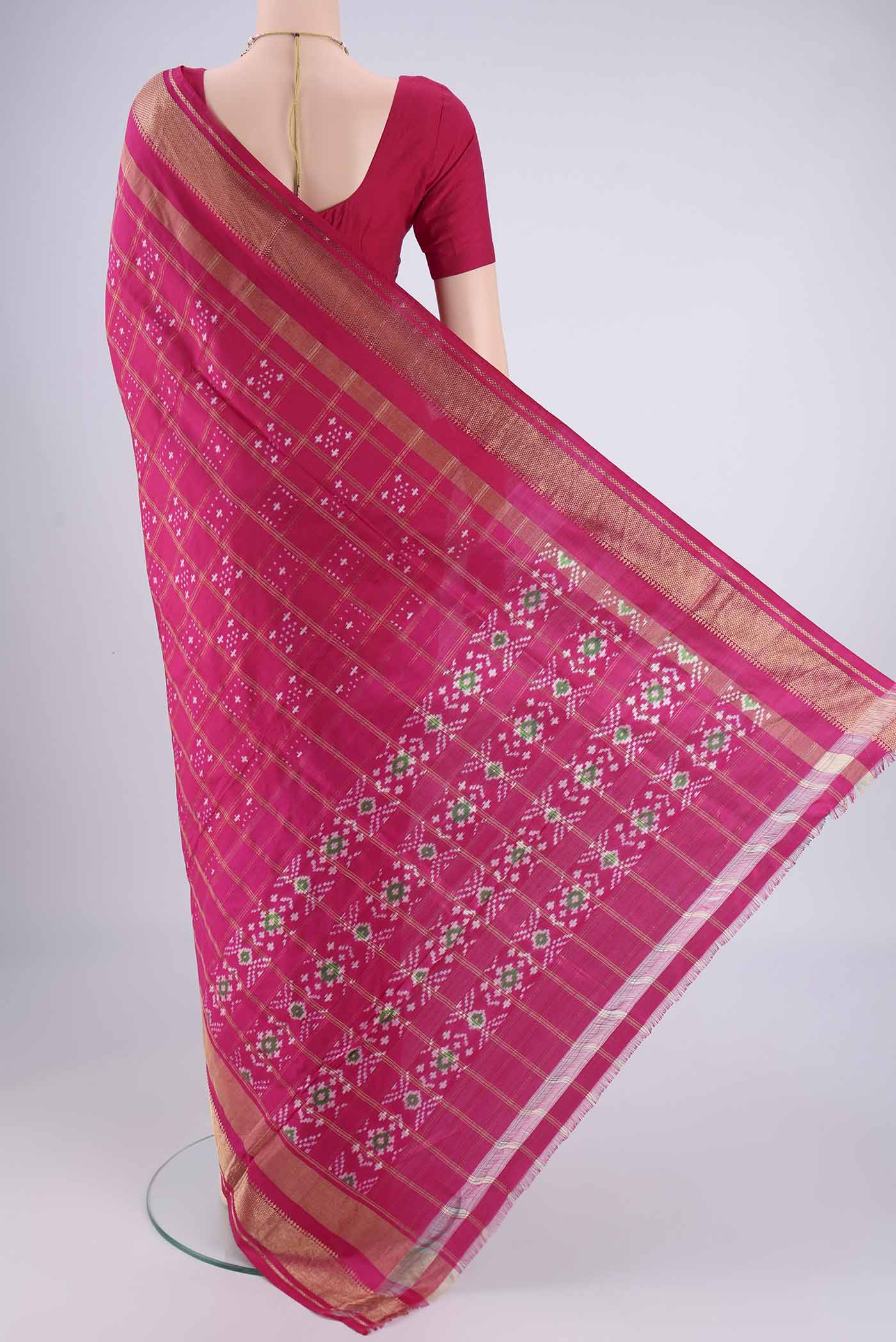Flat view of Pink Pochampally Silk Saree with Pure Ikat on the body and Zari Border. 