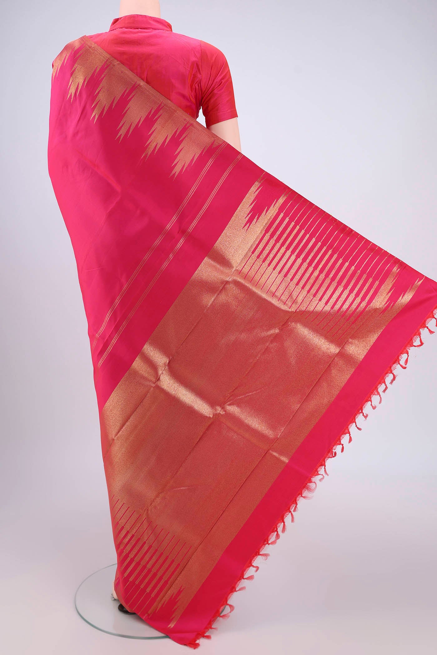 Flat view of Pure Silk Pure Zari Rani Pink Kanchipuram Saree with Plain Body and Temple Border. 