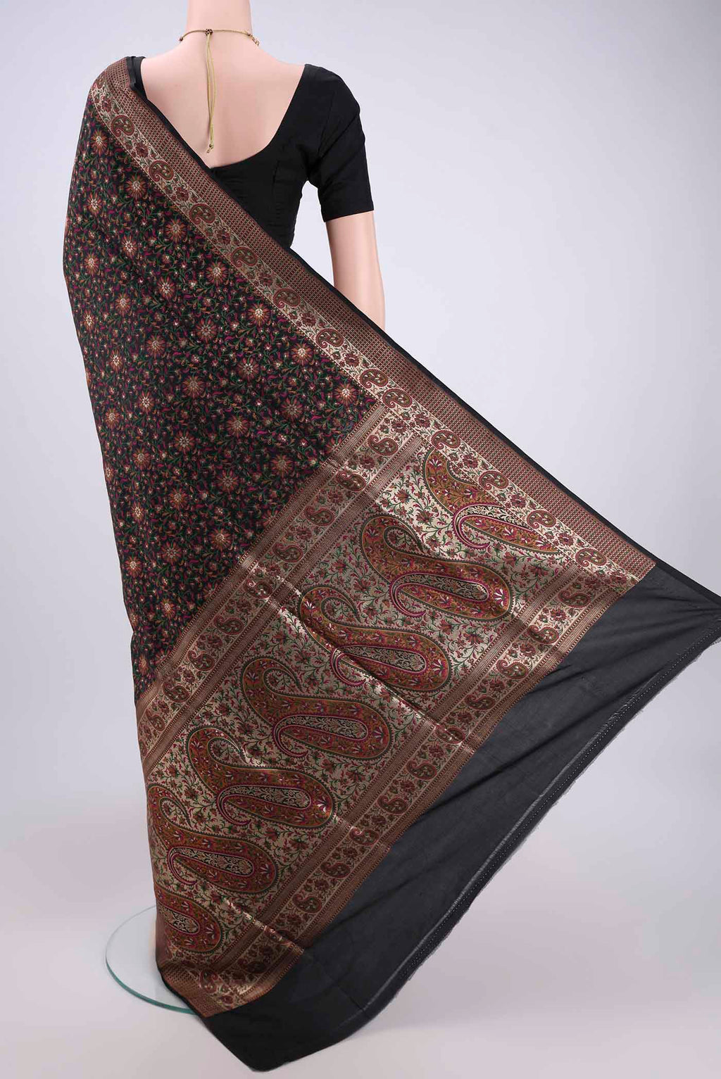 Flat view of Black Banarasi Tanchoi Silk Saree with Jacquard design on the body and Thread Border. 