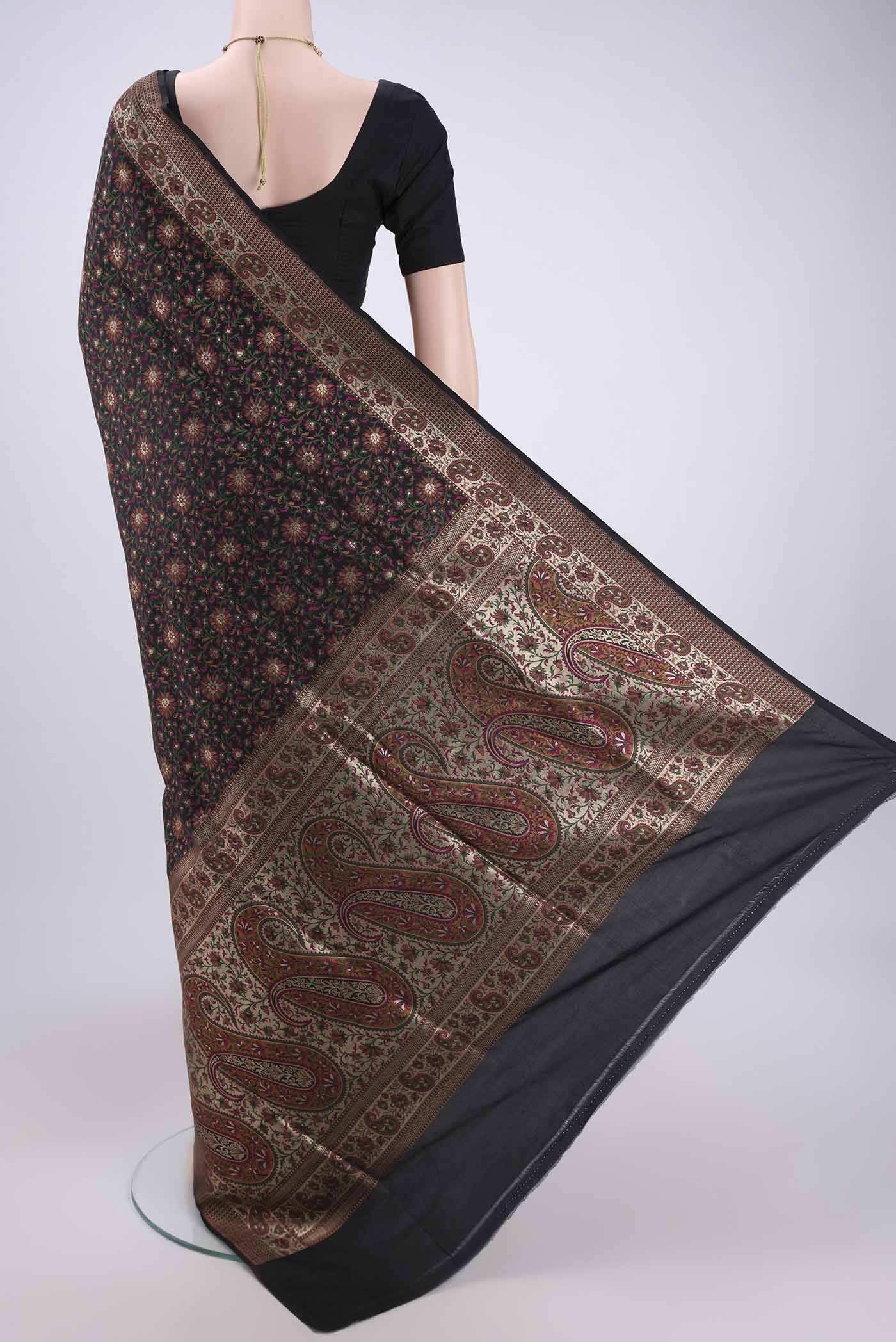Flat view of Black Banarasi Tanchoi Silk Saree with Jacquard design on the body and Thread Border. 