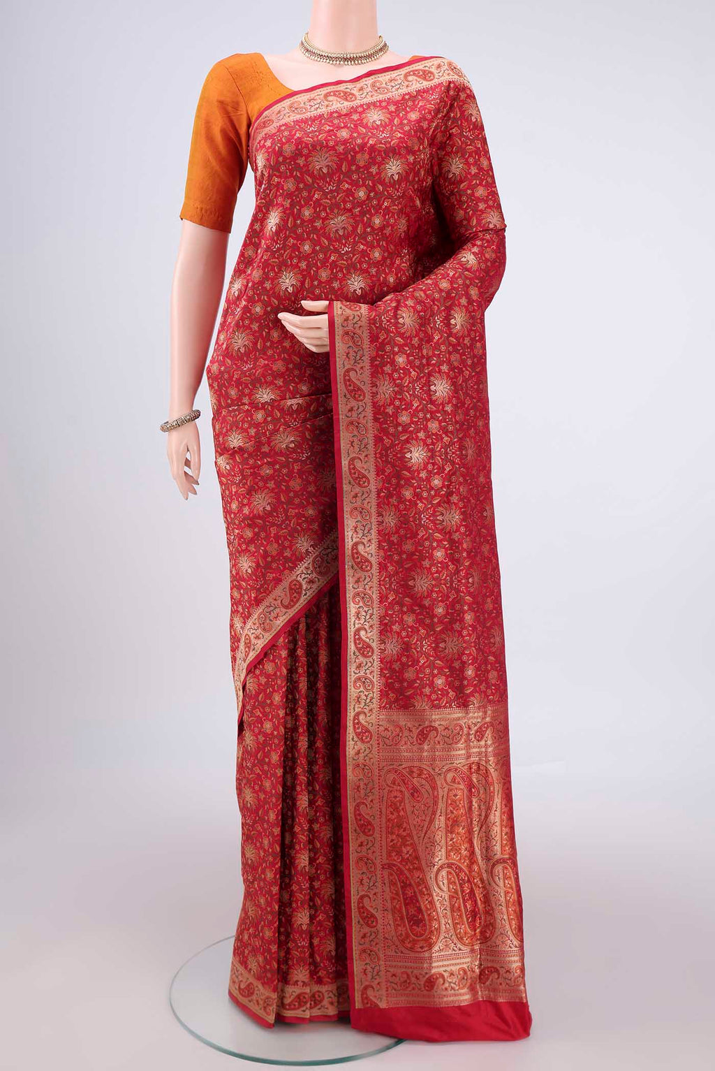 Red Banarasi Jamavar Saree with Jacquard With Zari Butta on the body and Zari Border.  displayed on a mannequin