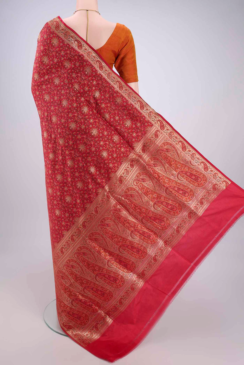 Flat view of Red Banarasi Jamavar Saree with Jacquard With Zari Butta on the body and Zari Border. 