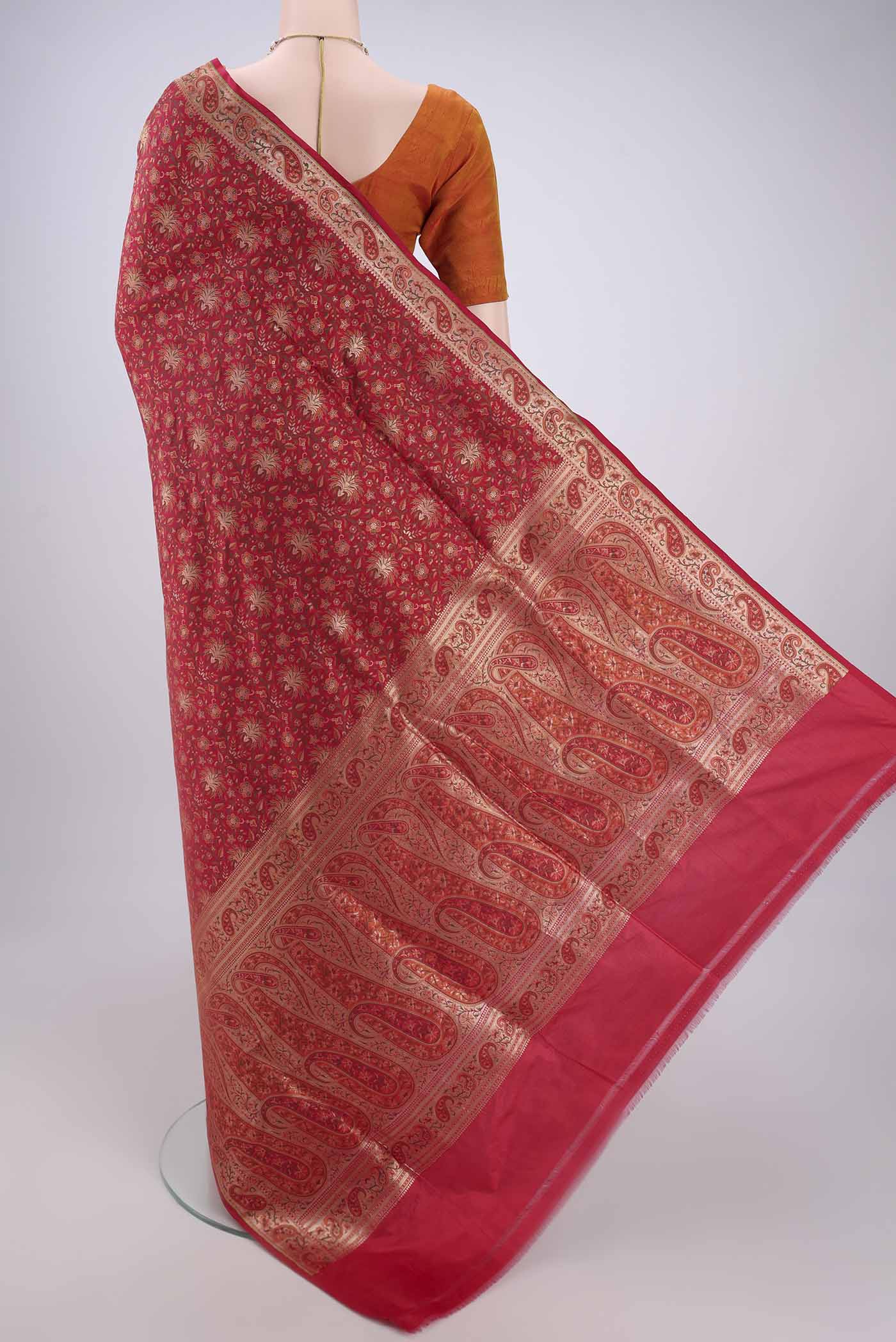 Flat view of Red Banarasi Jamavar Saree with Jacquard With Zari Butta on the body and Zari Border. 