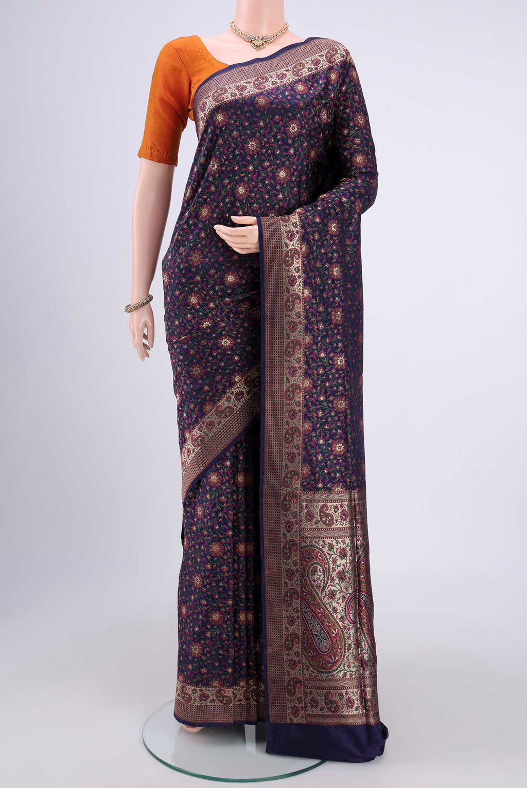 Navy Blue Banarasi Silk Saree with Jacquard With Zari Butta on the body and Zari And Thread Border.  displayed on a mannequin