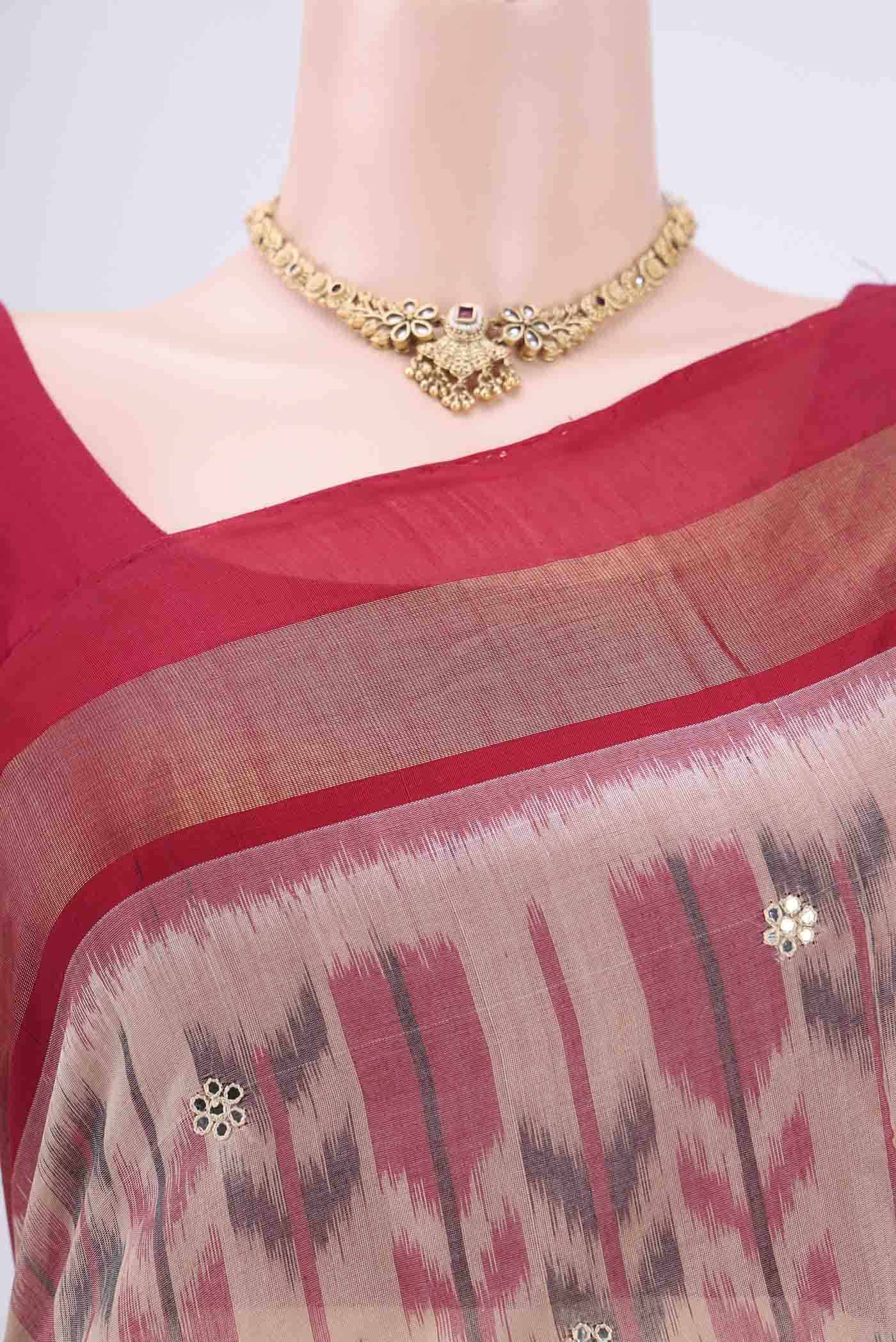 Border image of Peach Silk Cotton Saree with Ikat design on the body and Zari Border. 