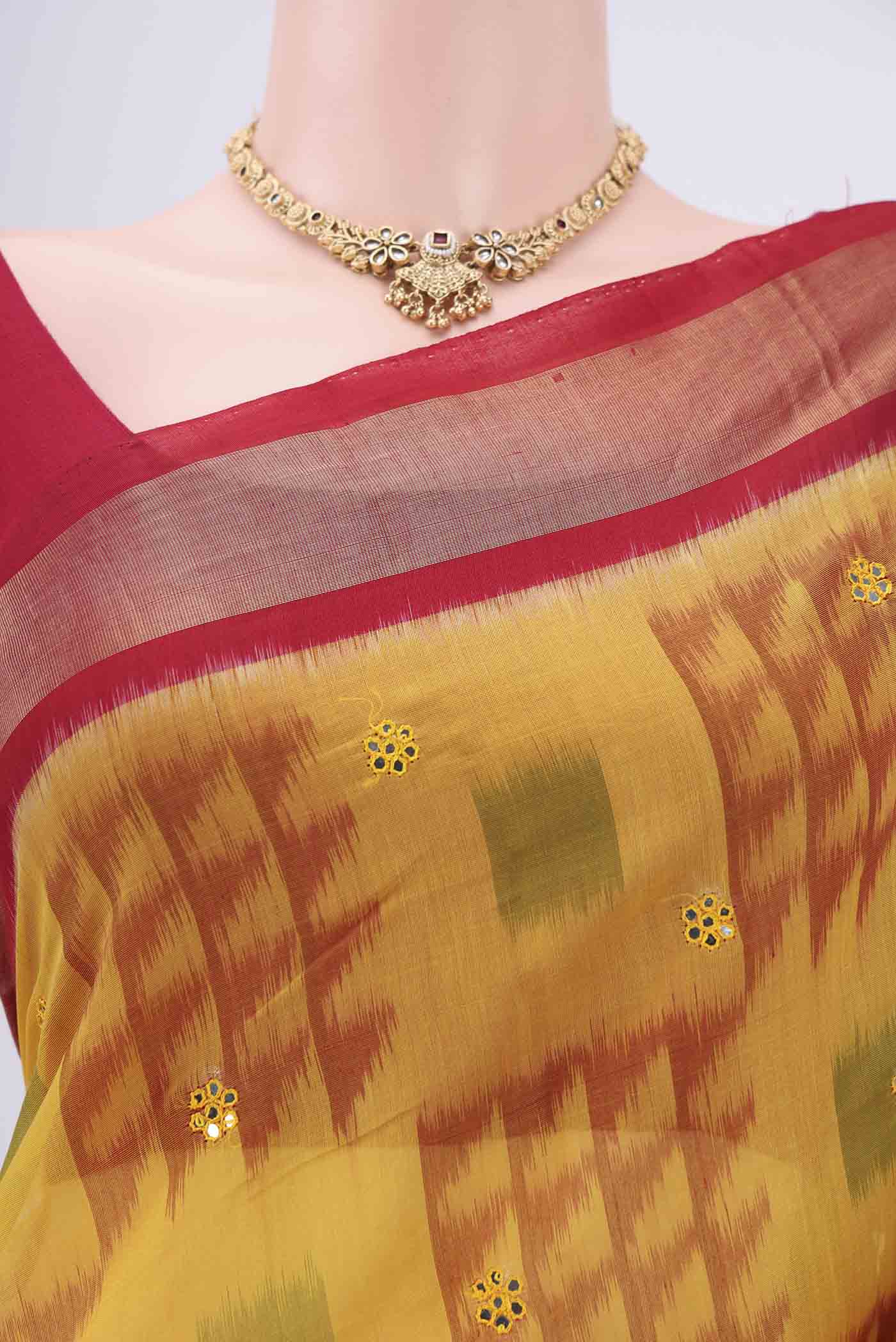 Border image of Yellow Silk Cotton Saree with Ikat design on the body and Zari Border. 
