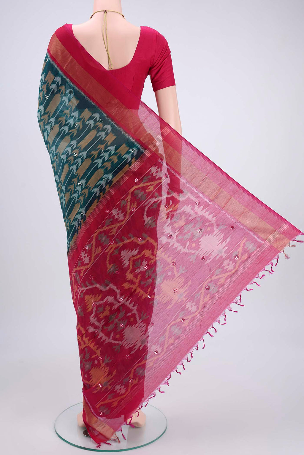 Flat view of Turquoise Pochampally Silk Saree with Pure Ikat on the body and Plain Border. 