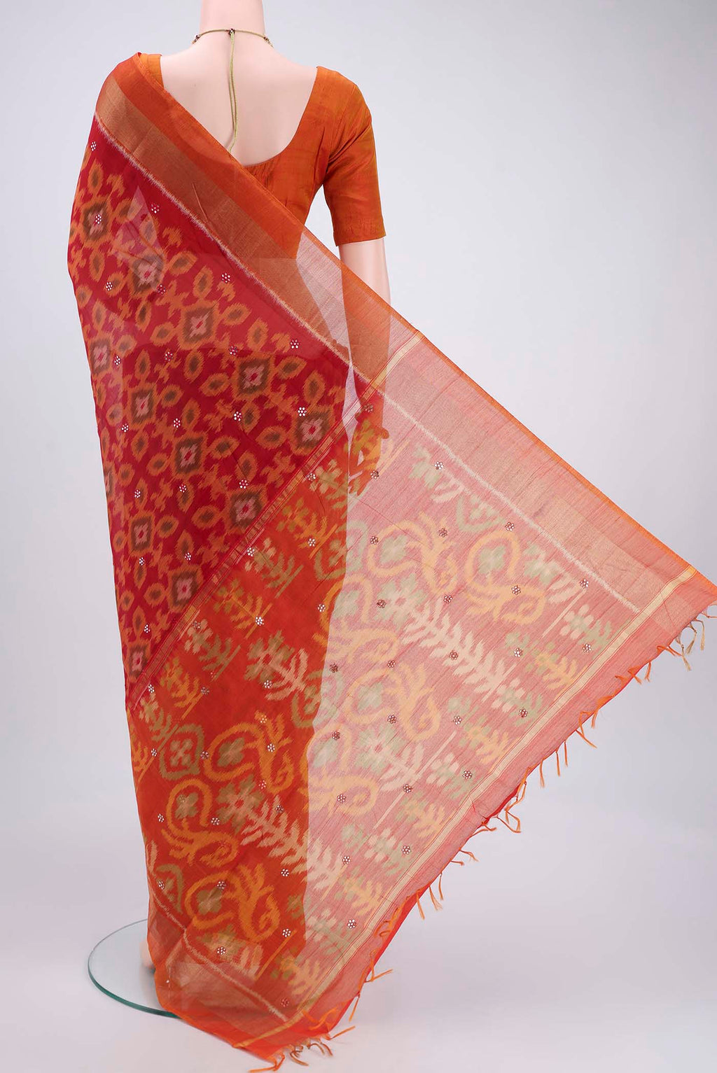 Flat view of Red Pochampally Silk Saree with Pure Ikat on the body and Plain Border. 