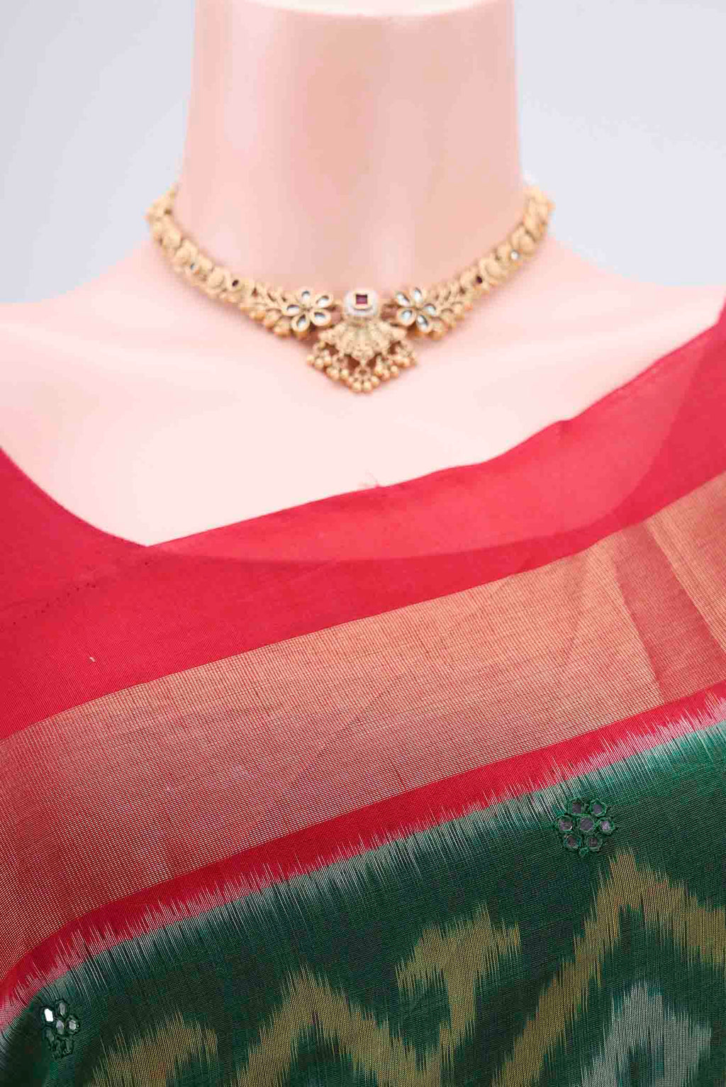 Border image of Green Kora Cotton Saree with Ikat design on the body and Zari Border. 