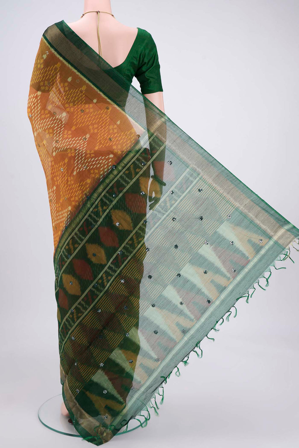 Flat view of Green Pochampally Silk Saree with Pure Ikat on the body and Plain Border. 