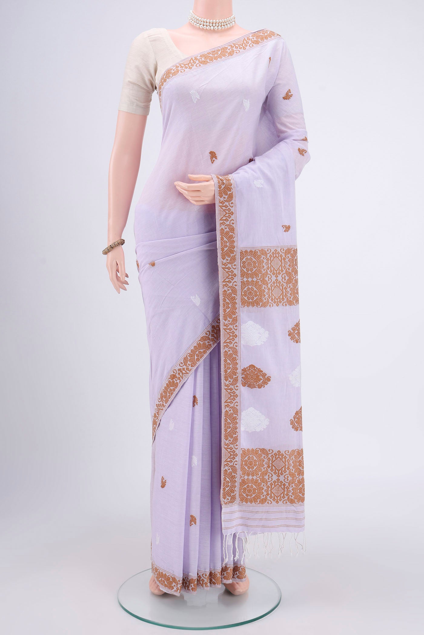 Purple Assam Cotton Saree with Thread Butta on the body and Plain Border.  displayed on a mannequin