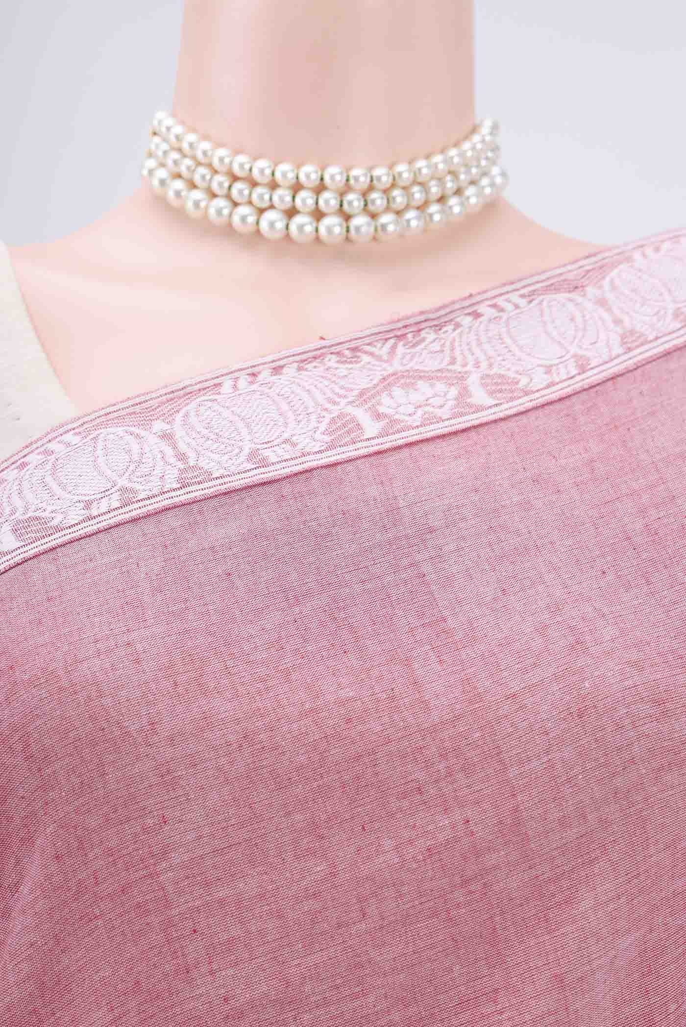 Border image of Pink Assam Cotton Saree with Thread Butta on the body and Plain Border. 