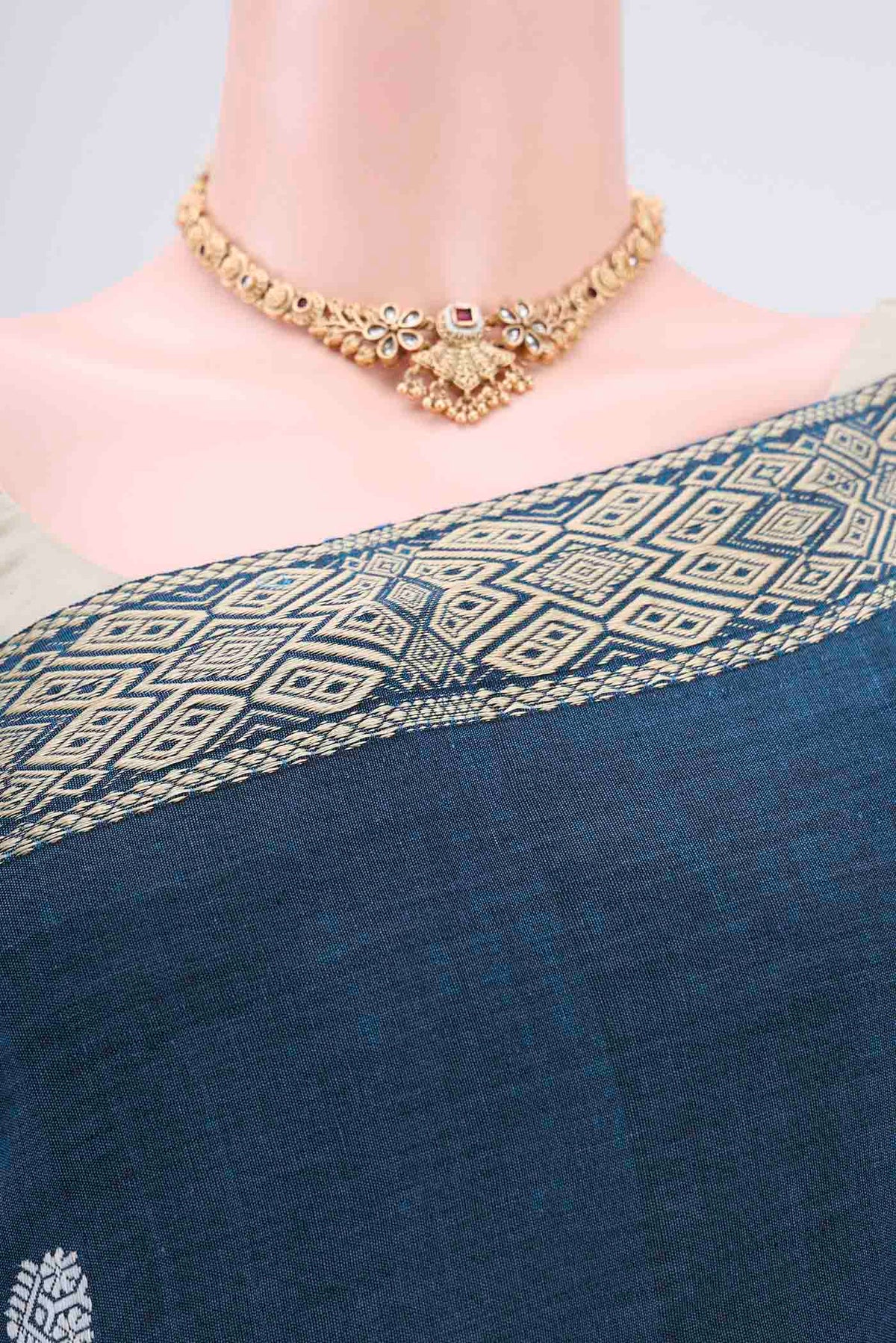 Border image of Turquoise Assam Cotton Saree with Thread Butta on the body and Plain Border. 
