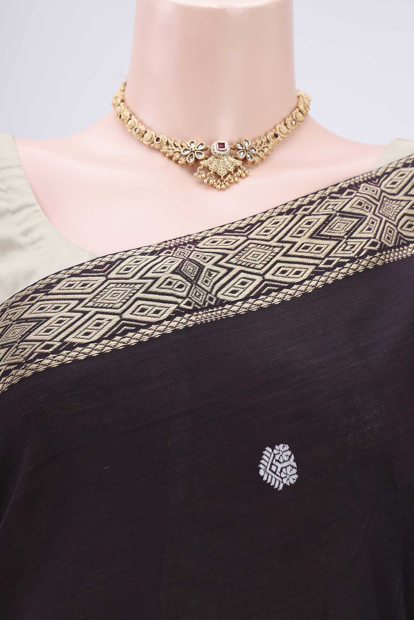 Border image of Coffee Brown Assam Cotton Saree with Thread Butta on the body and Plain Border. 