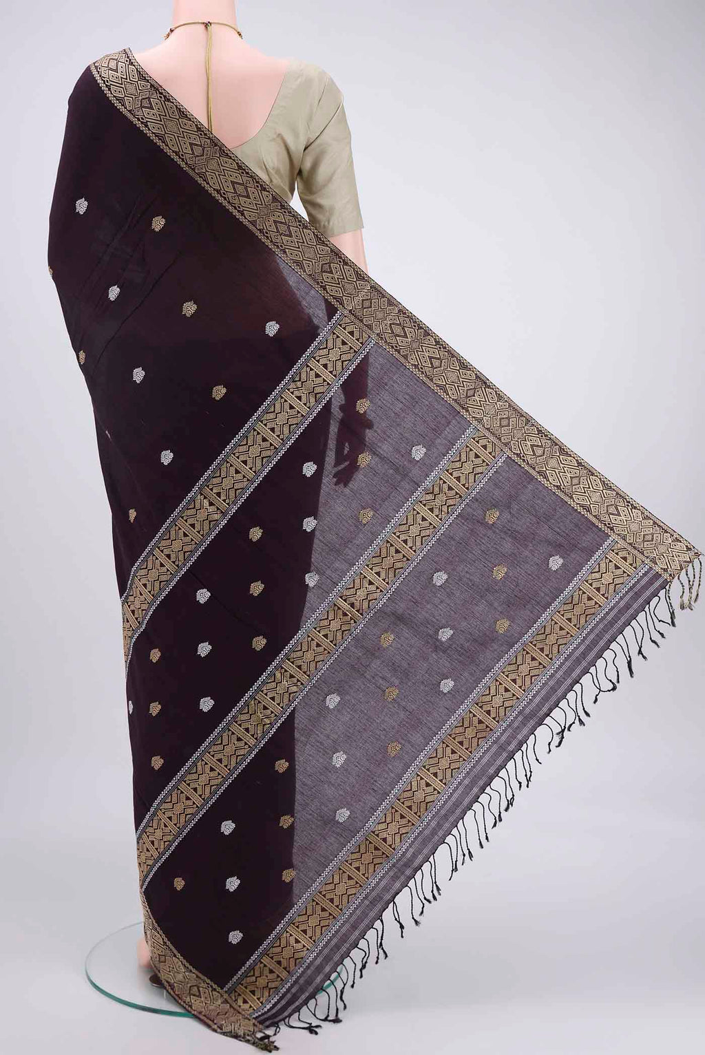 Flat view of Coffee Brown Assam Cotton Saree with Thread Butta on the body and Plain Border. 