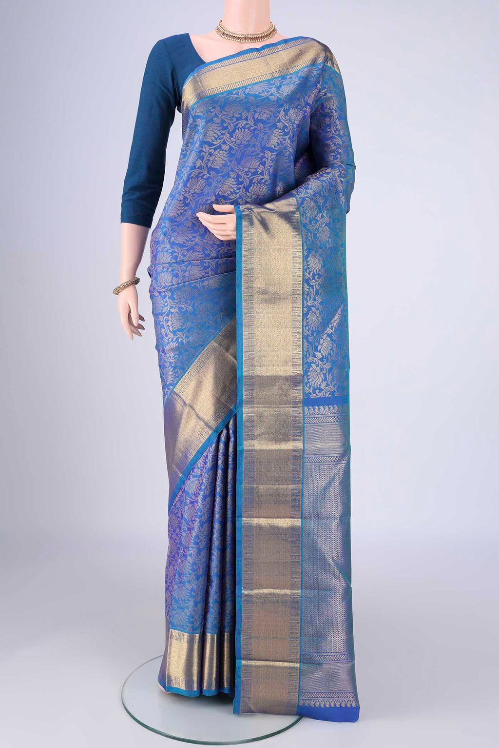 Pure Silk Pure Zari Royal Blue Kanjivaram Saree with Zari Brocade on the body and Zari Border.  displayed on a mannequin