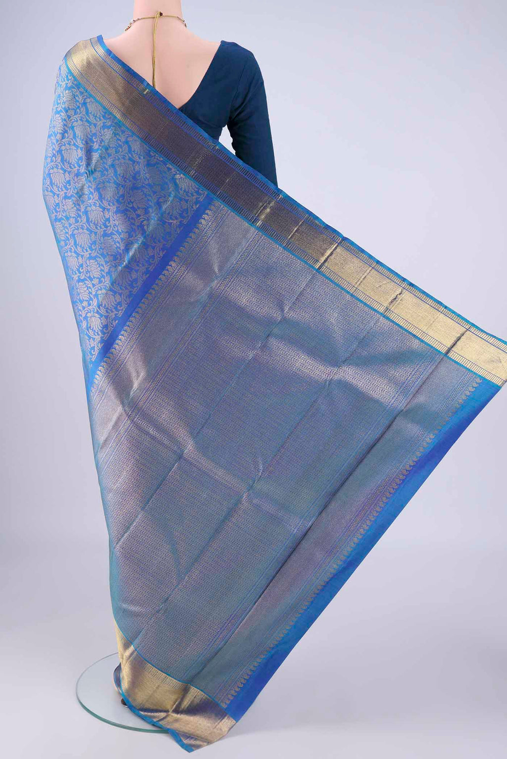 Flat view of Pure Silk Pure Zari Royal Blue Kanjivaram Saree with Zari Brocade on the body and Zari Border. 