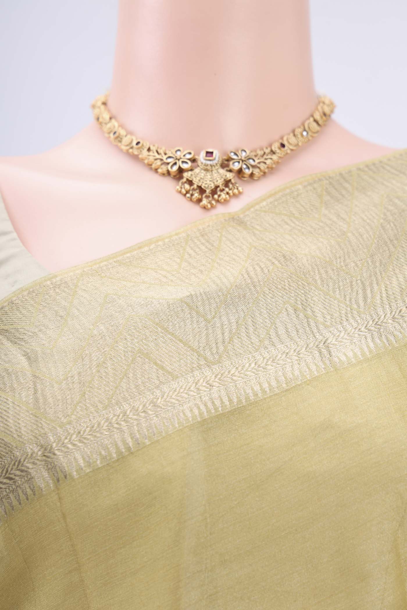 Border image of Yellow Mysore Crepe Saree with Fancy on the body and Zari Border. 