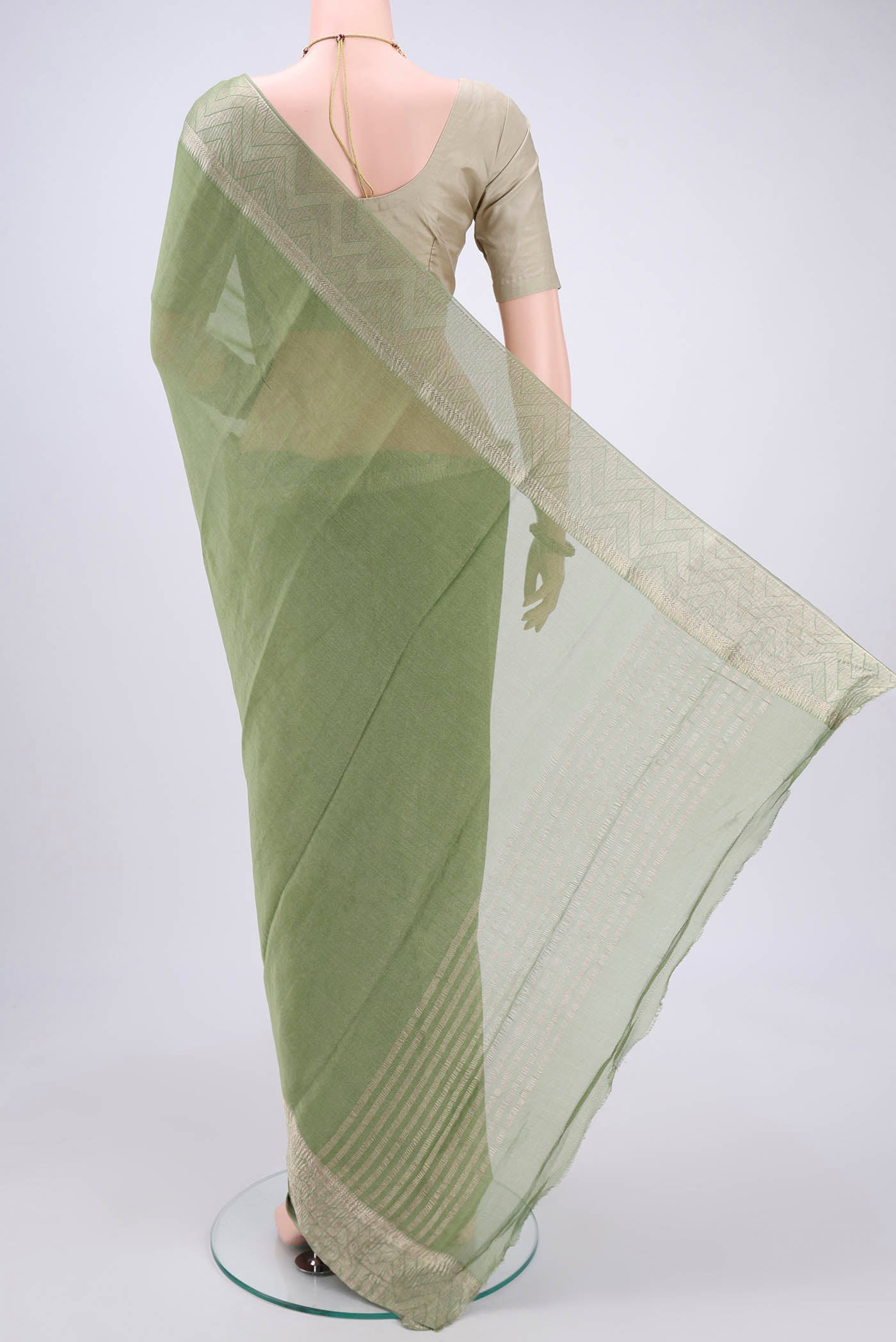 Flat view of Light Green Mysore Crepe Saree with Fancy on the body and Zari Border. 